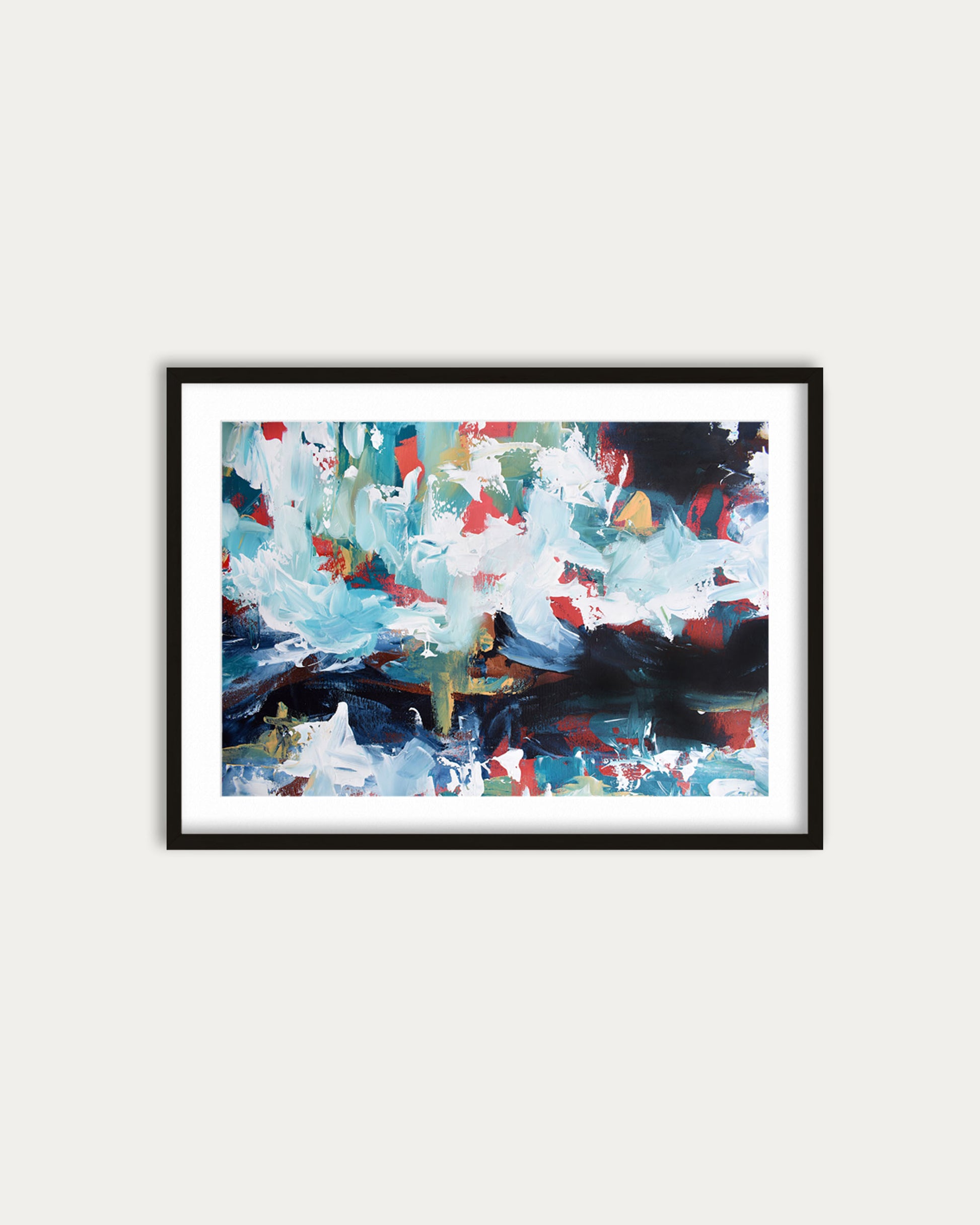 Framed abstract painting with colorful brush strokes on a white wall