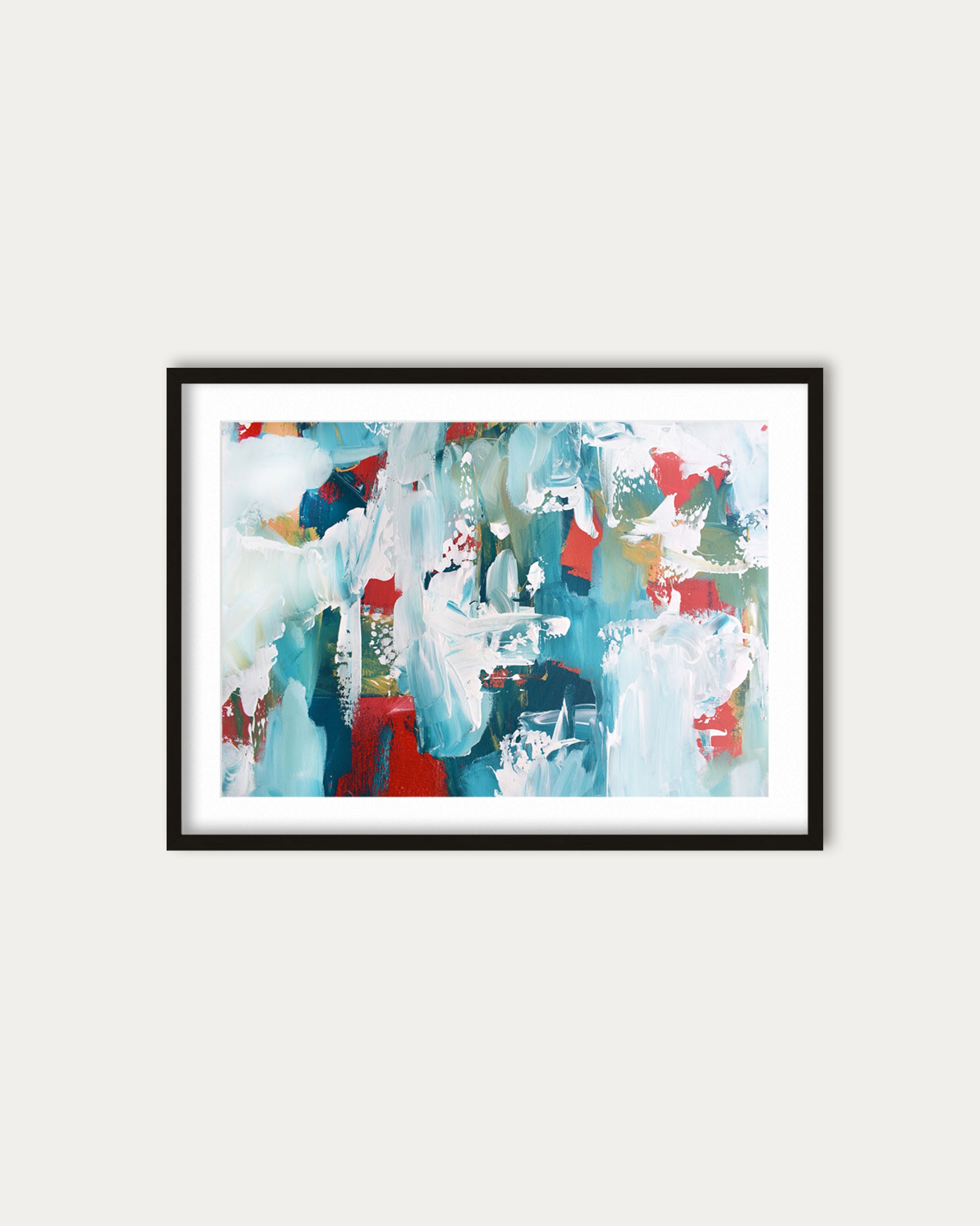 Framed abstract art print with colorful brush strokes on a white wall