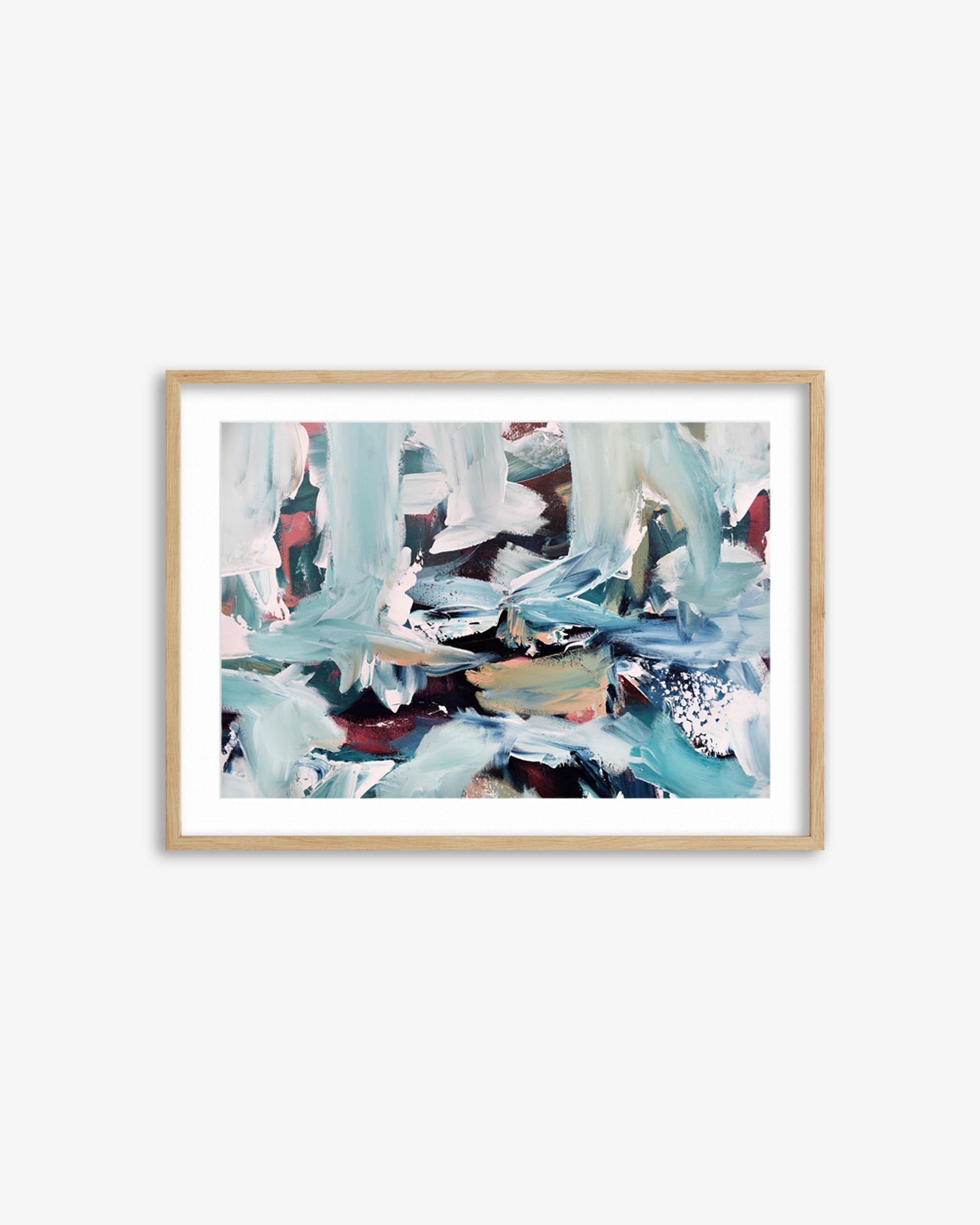 Framed abstract artwork with blue and white tones on a white wall