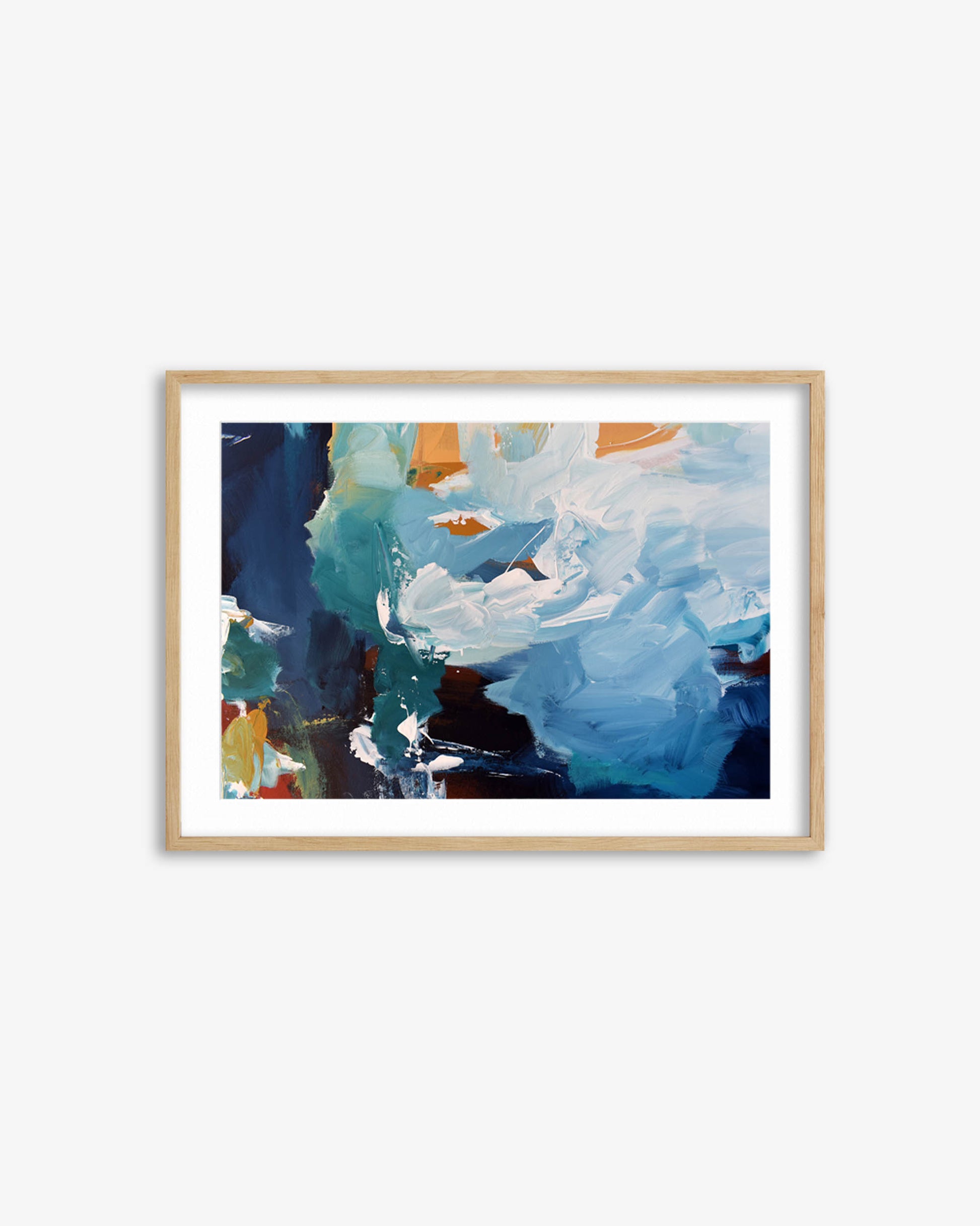 Framed abstract artwork with blue and orange colors on a white wall