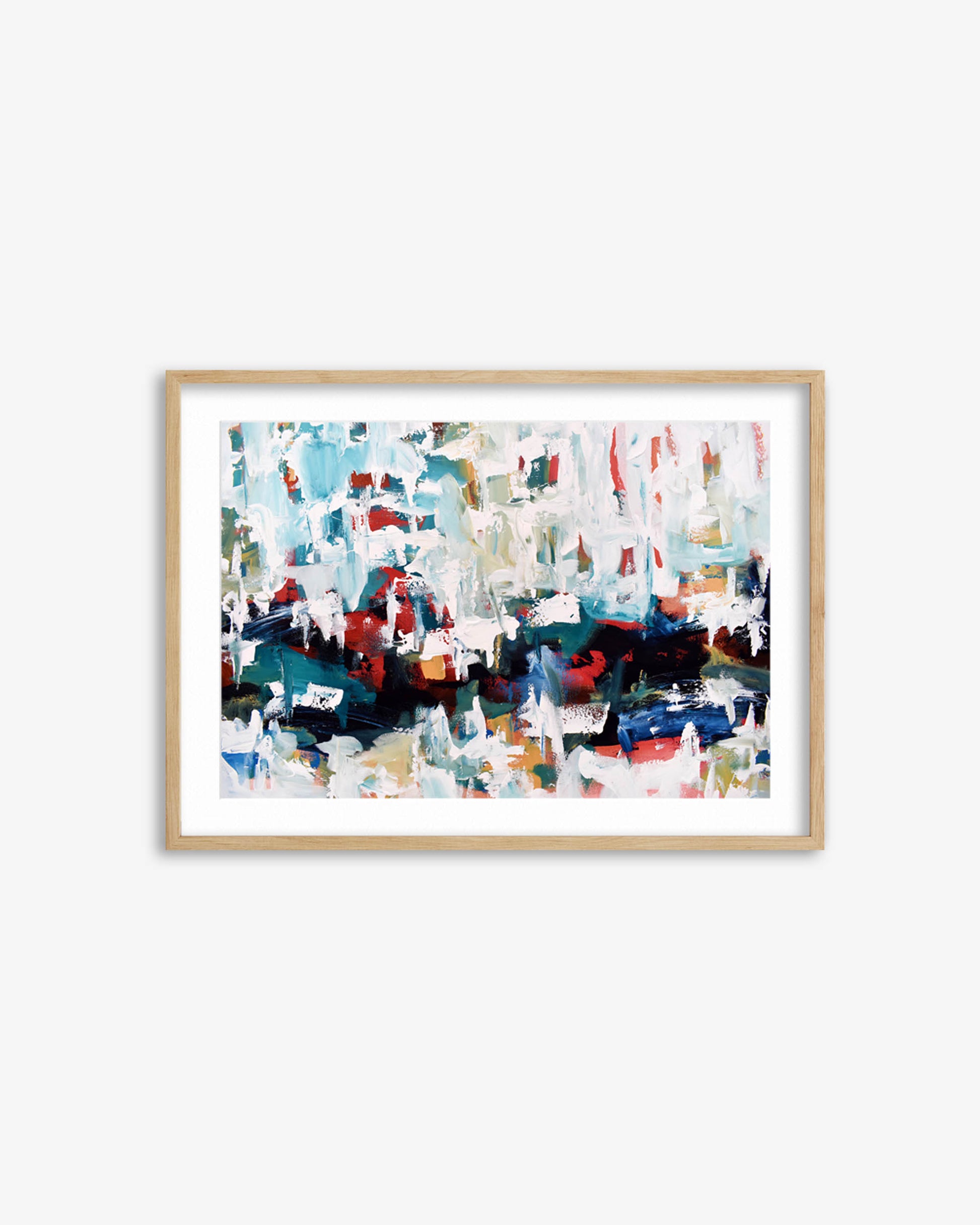 Framed abstract art print with colorful brush strokes on a white wall