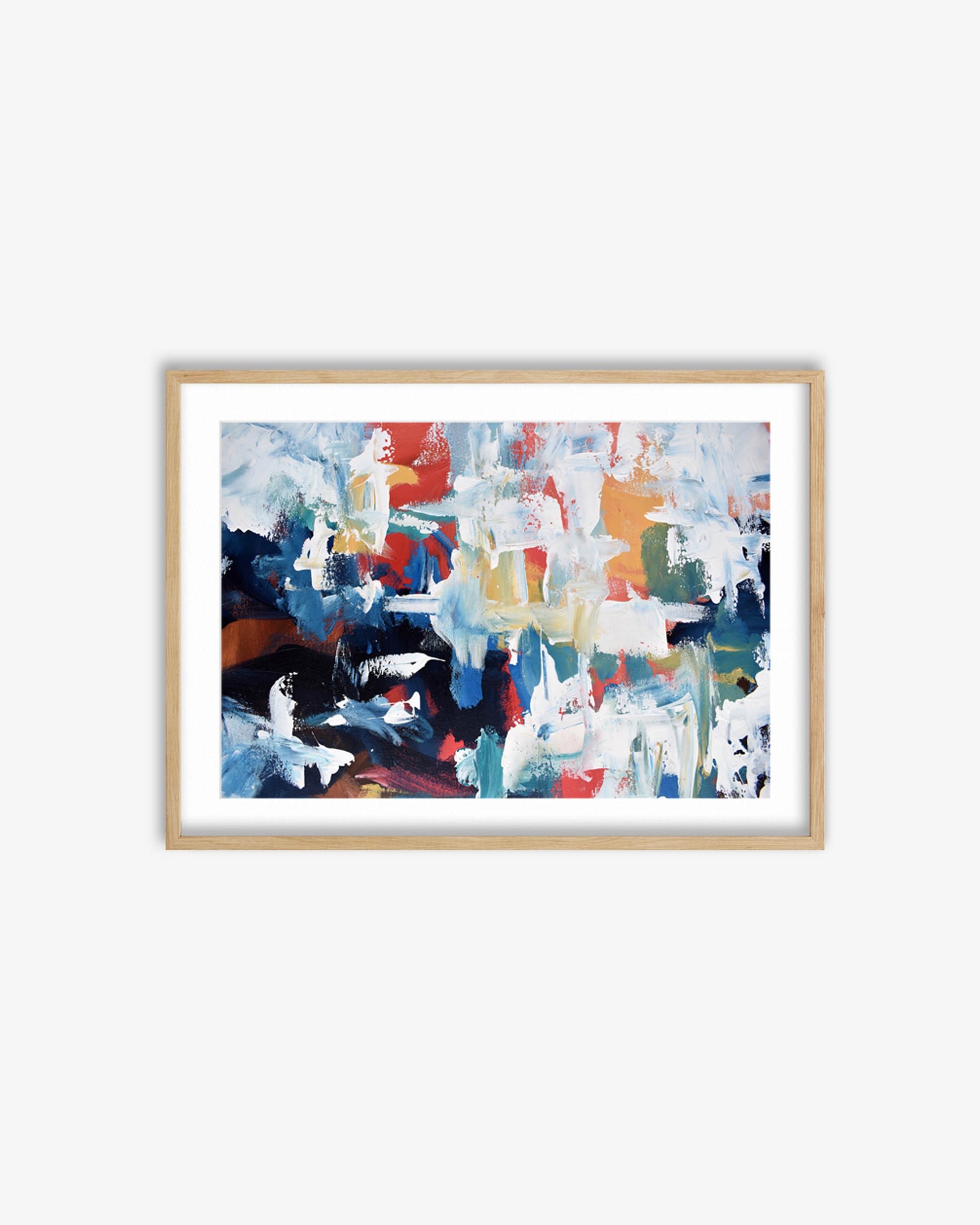 Framed abstract art print with colorful brush strokes on a white wall