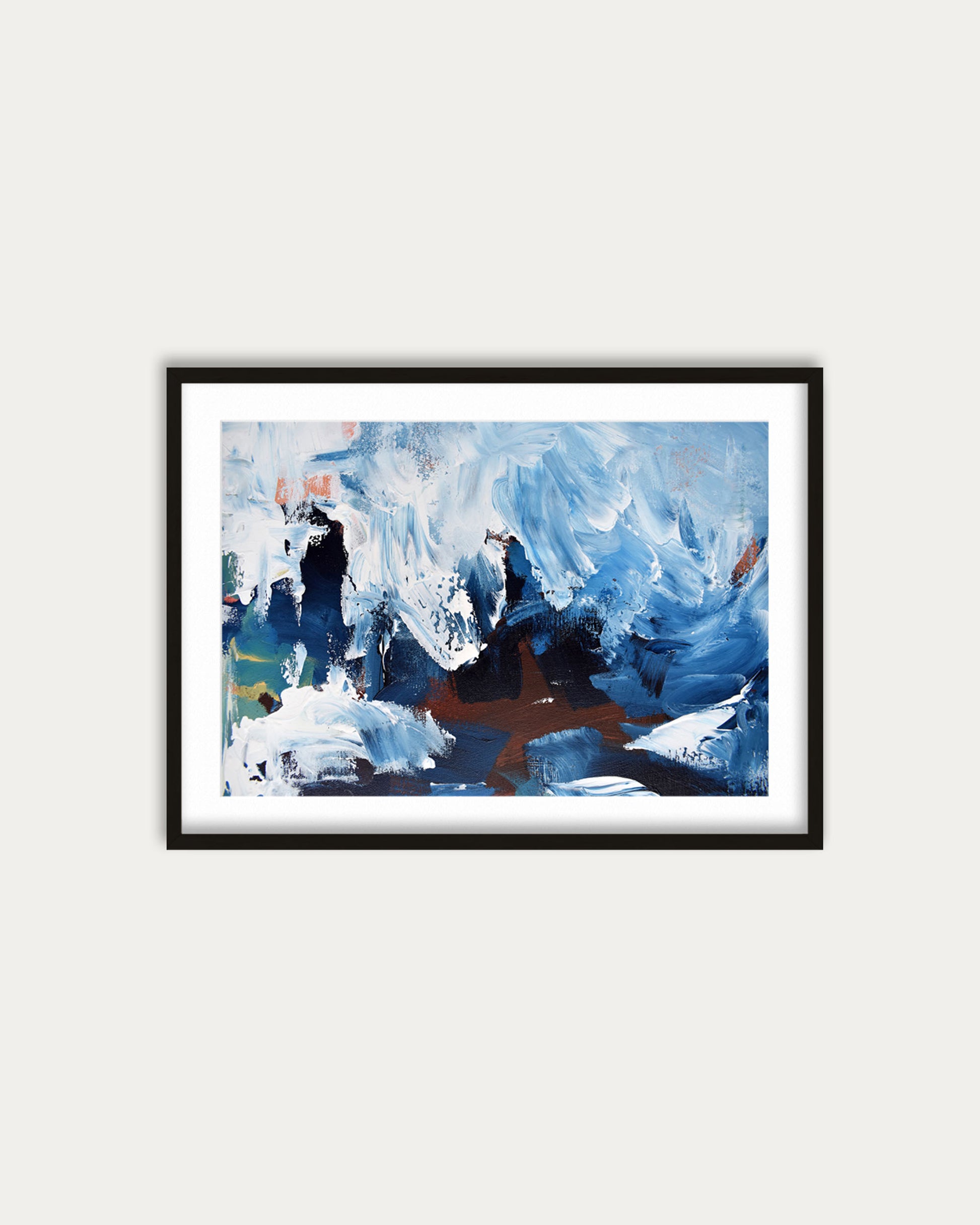 Framed abstract painting with blue and white tones on a light gray wall