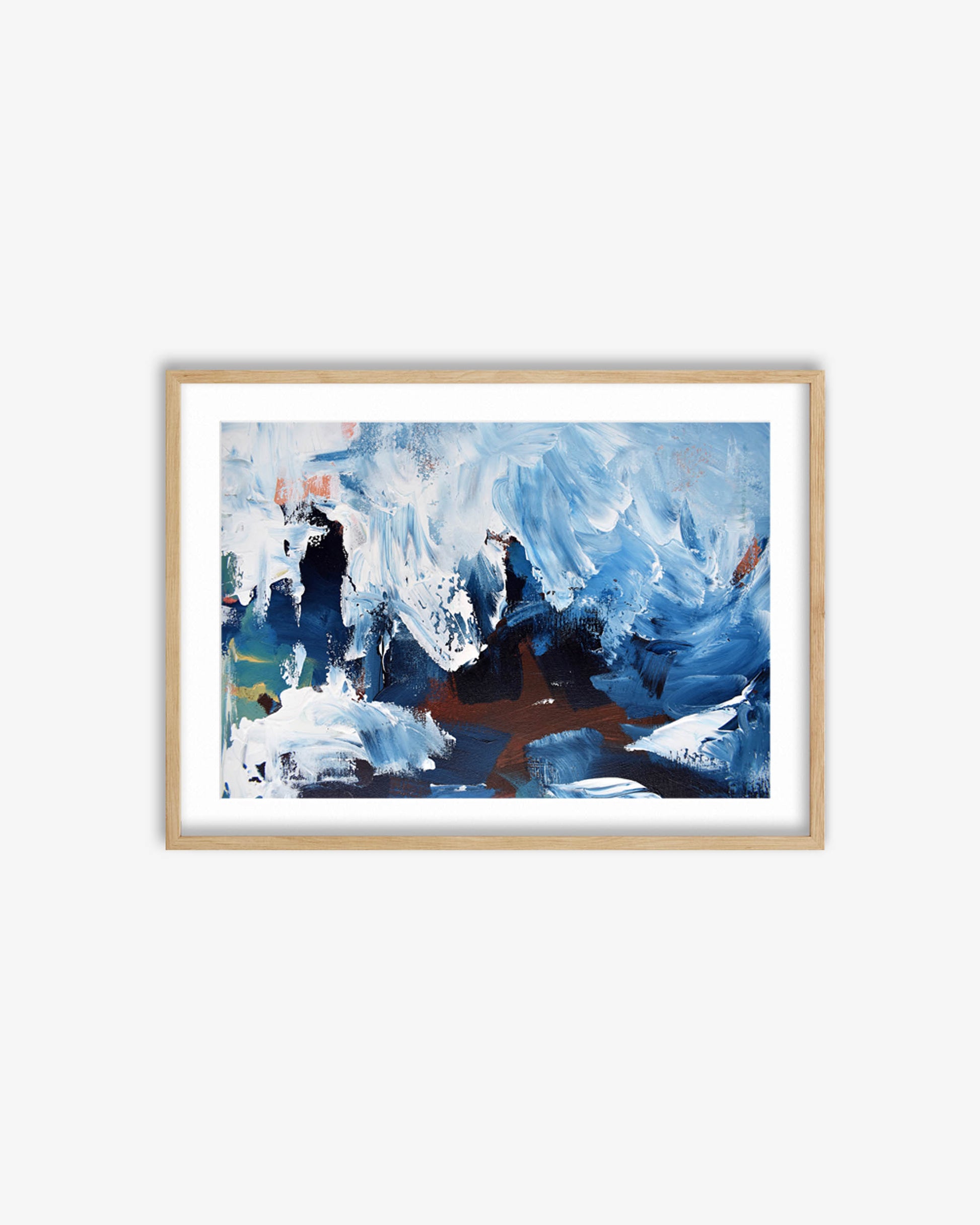 Framed abstract painting with blue and brown tones on a white wall