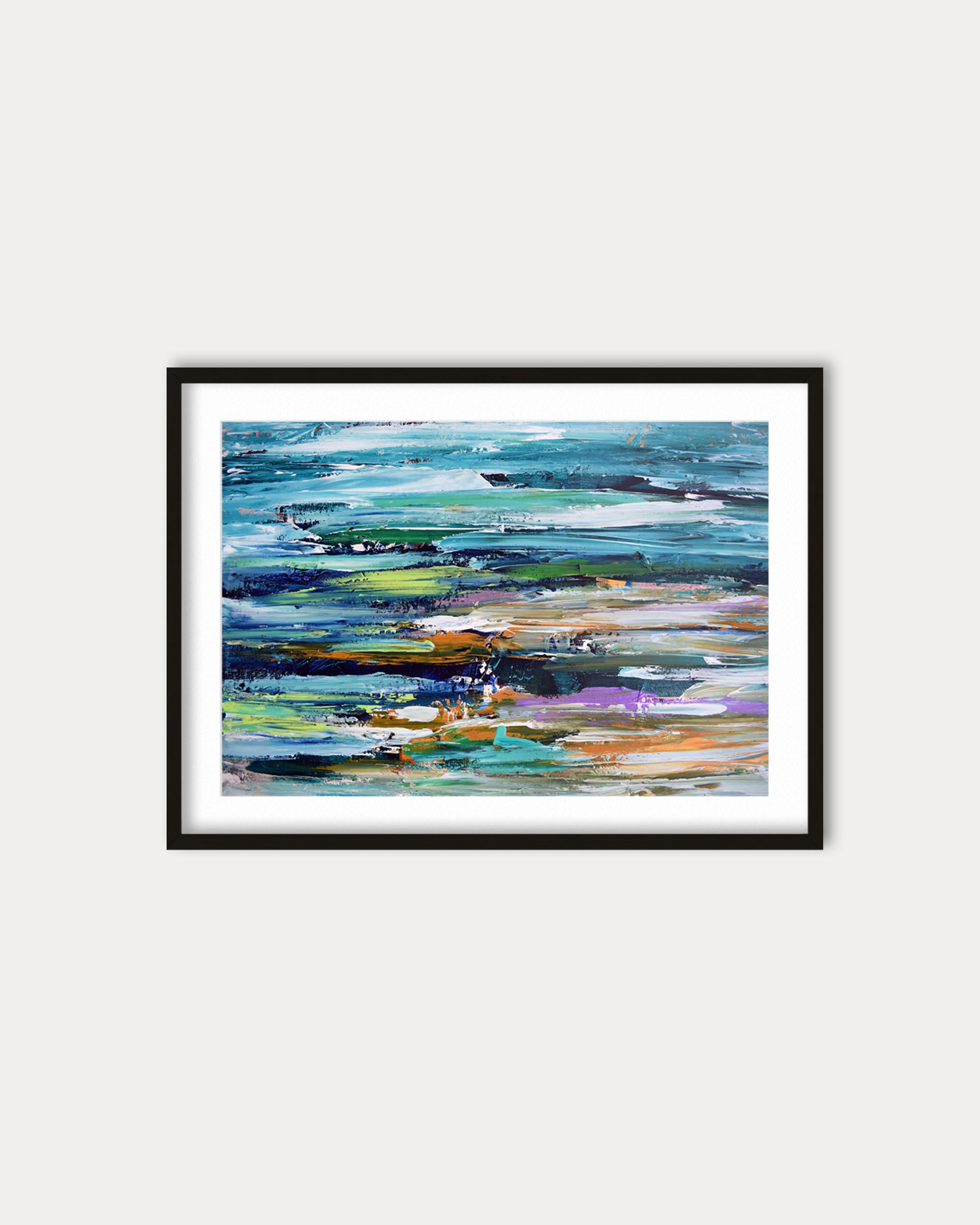 Framed abstract painting with colorful brush strokes on a white wall