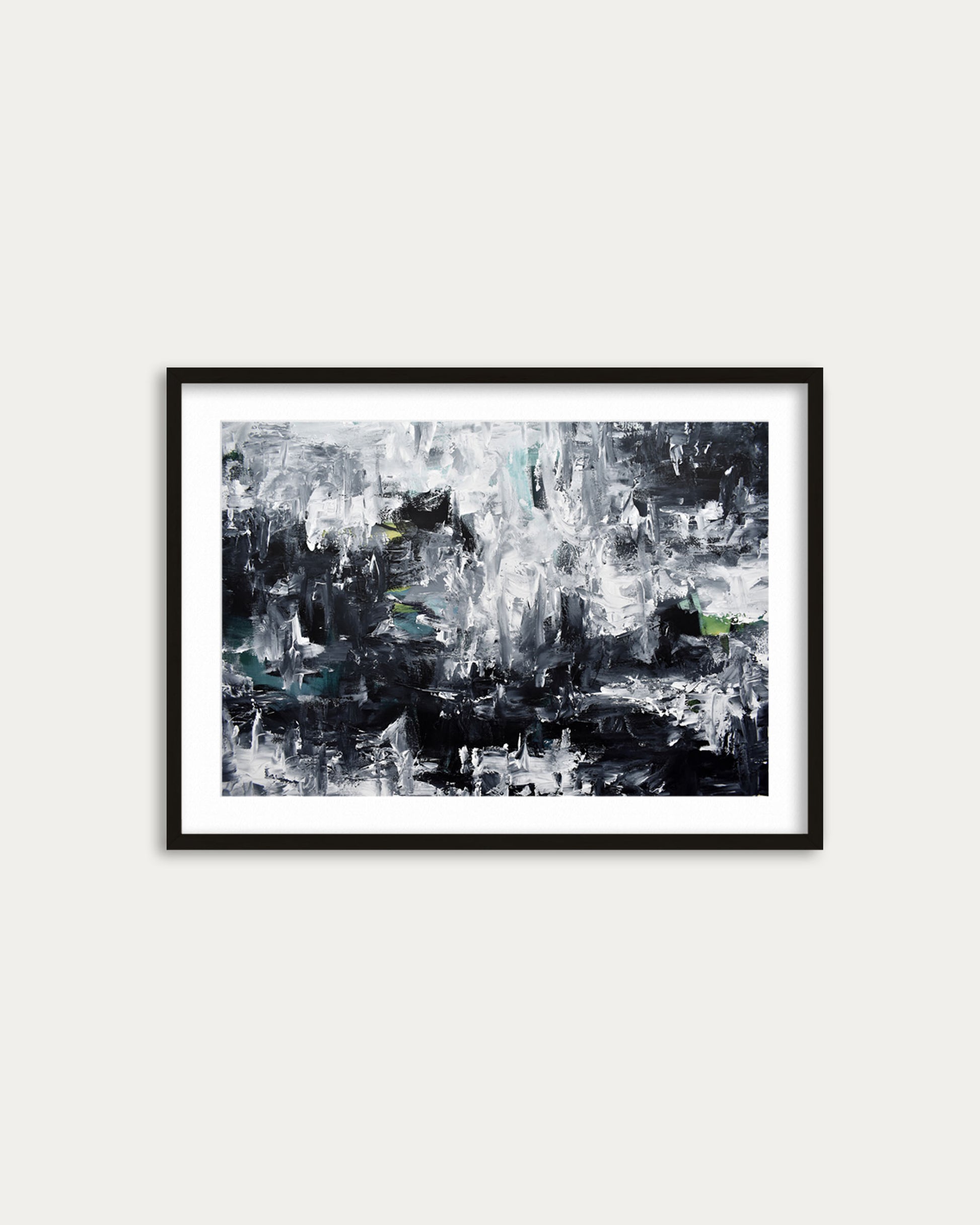 Framed abstract art print on a white wall