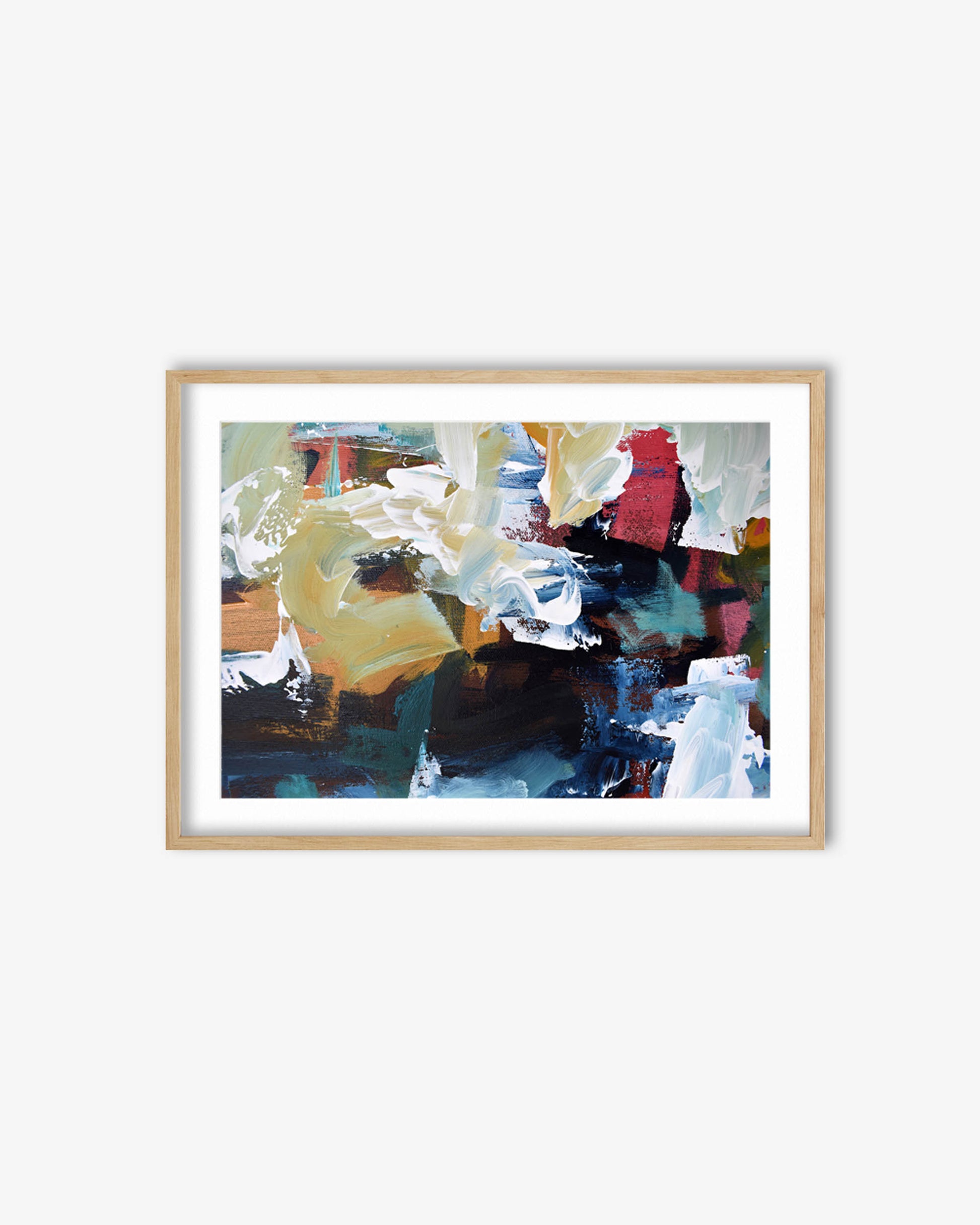 Framed abstract art print with colorful brush strokes on a white wall