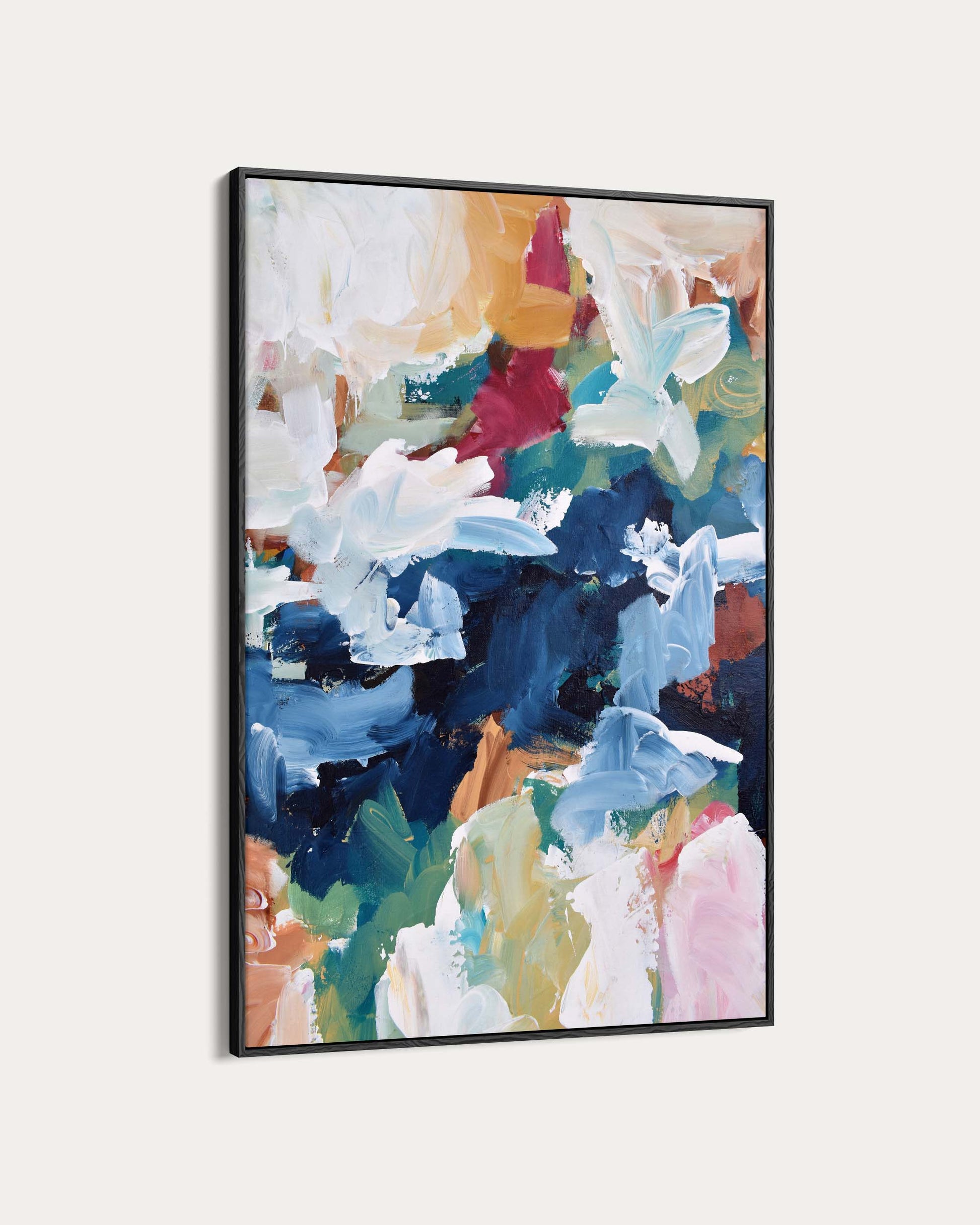 Abstract art print with colorful brush strokes in a black frame on a white background
