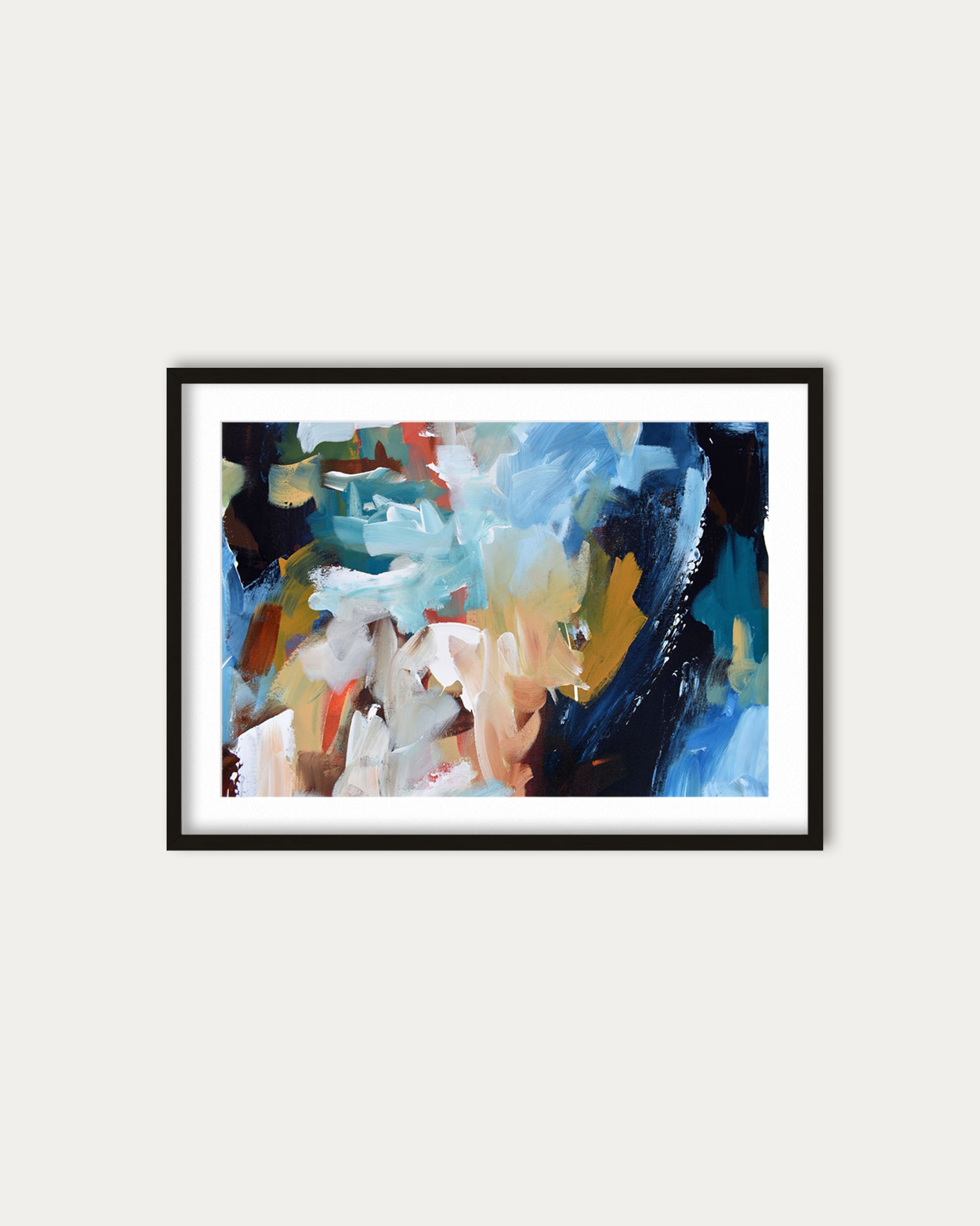Framed abstract painting with colorful brush strokes on a white wall