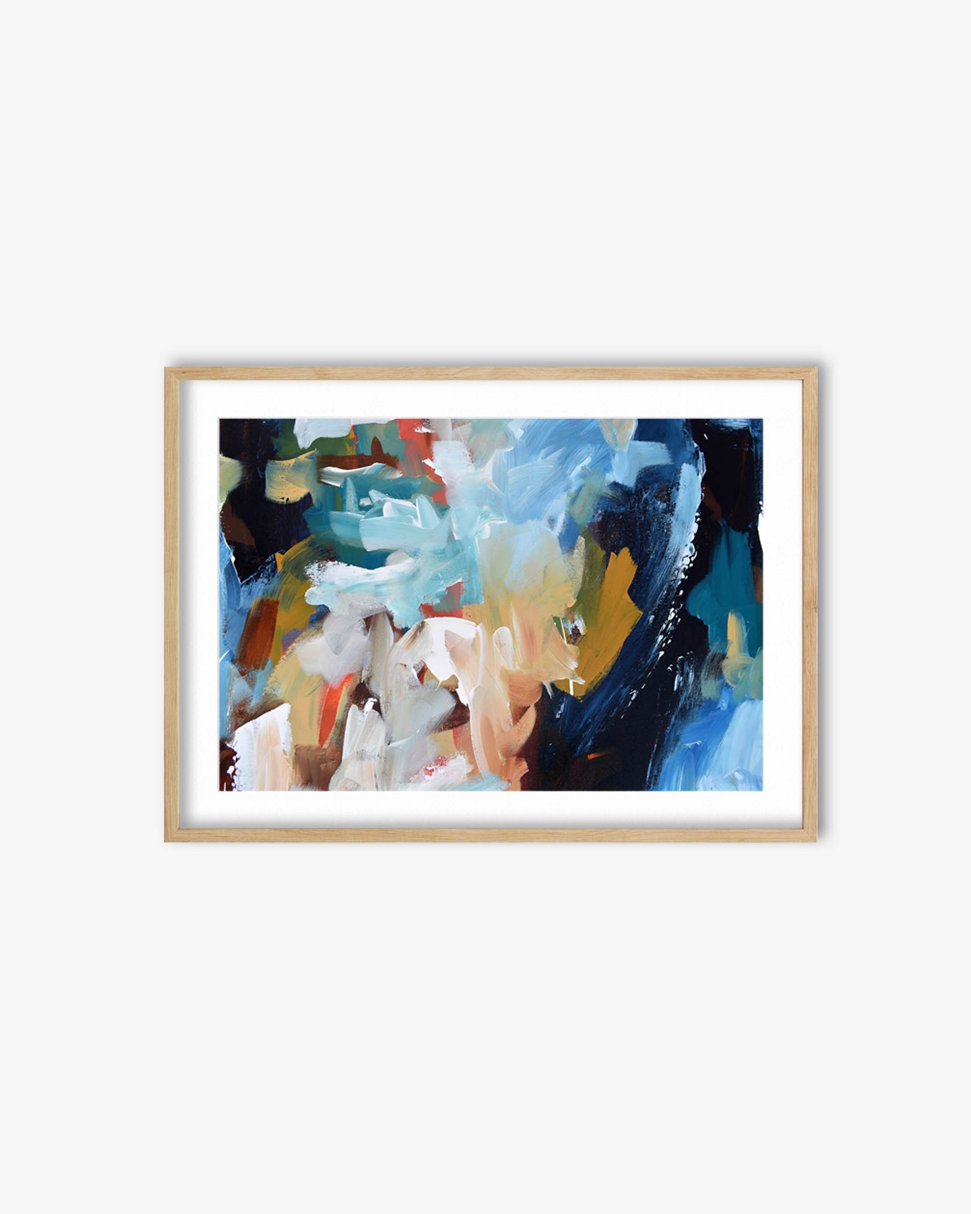Framed abstract art print with colorful brush strokes on a white wall