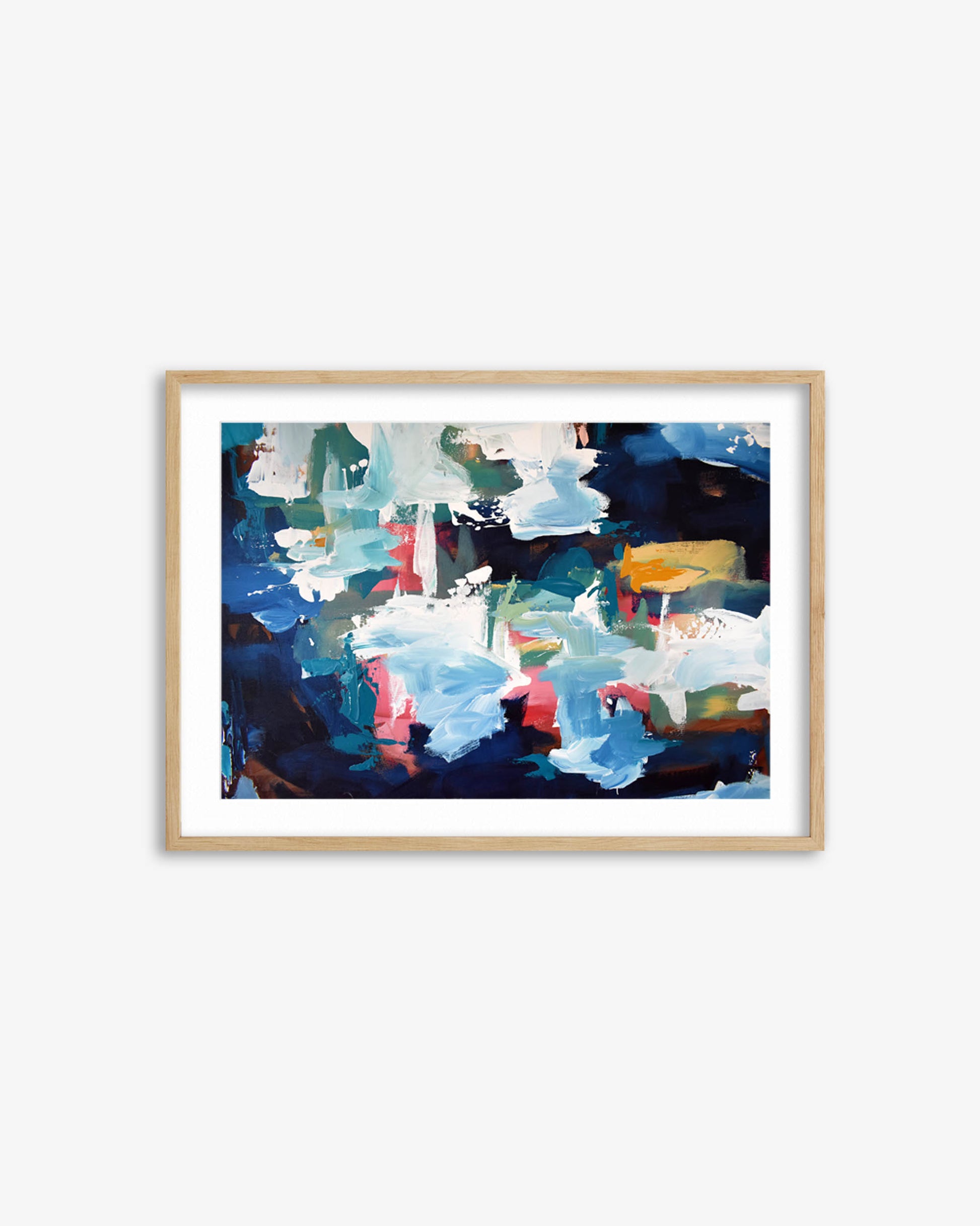 Framed abstract art print with colorful brush strokes on a white wall