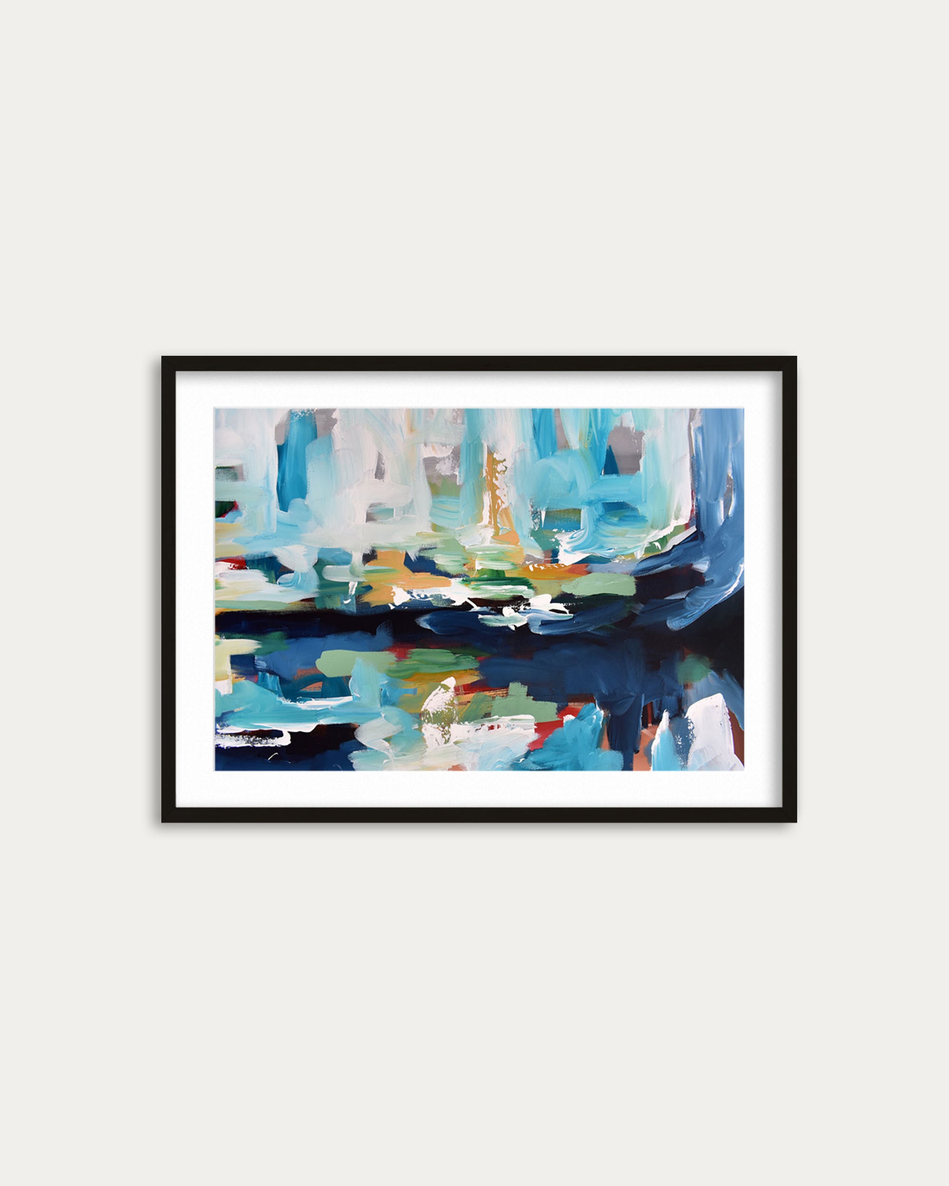 Framed abstract painting with blue and multicolor design on a white wall
