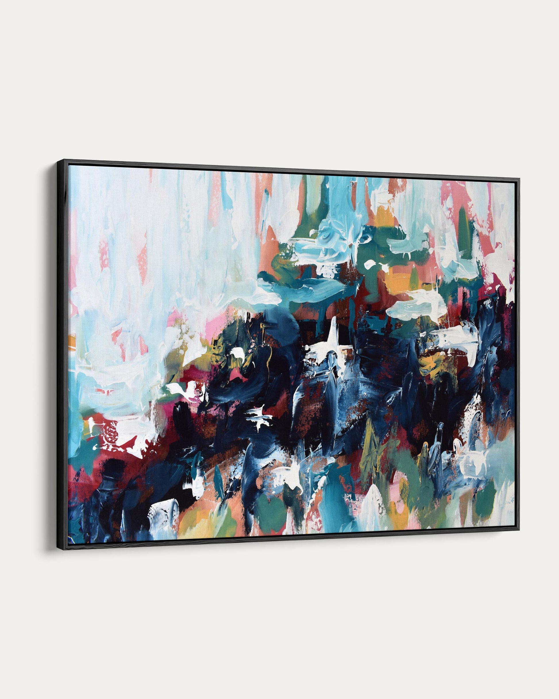 Abstract painting with vibrant colors in a black frame on a white background