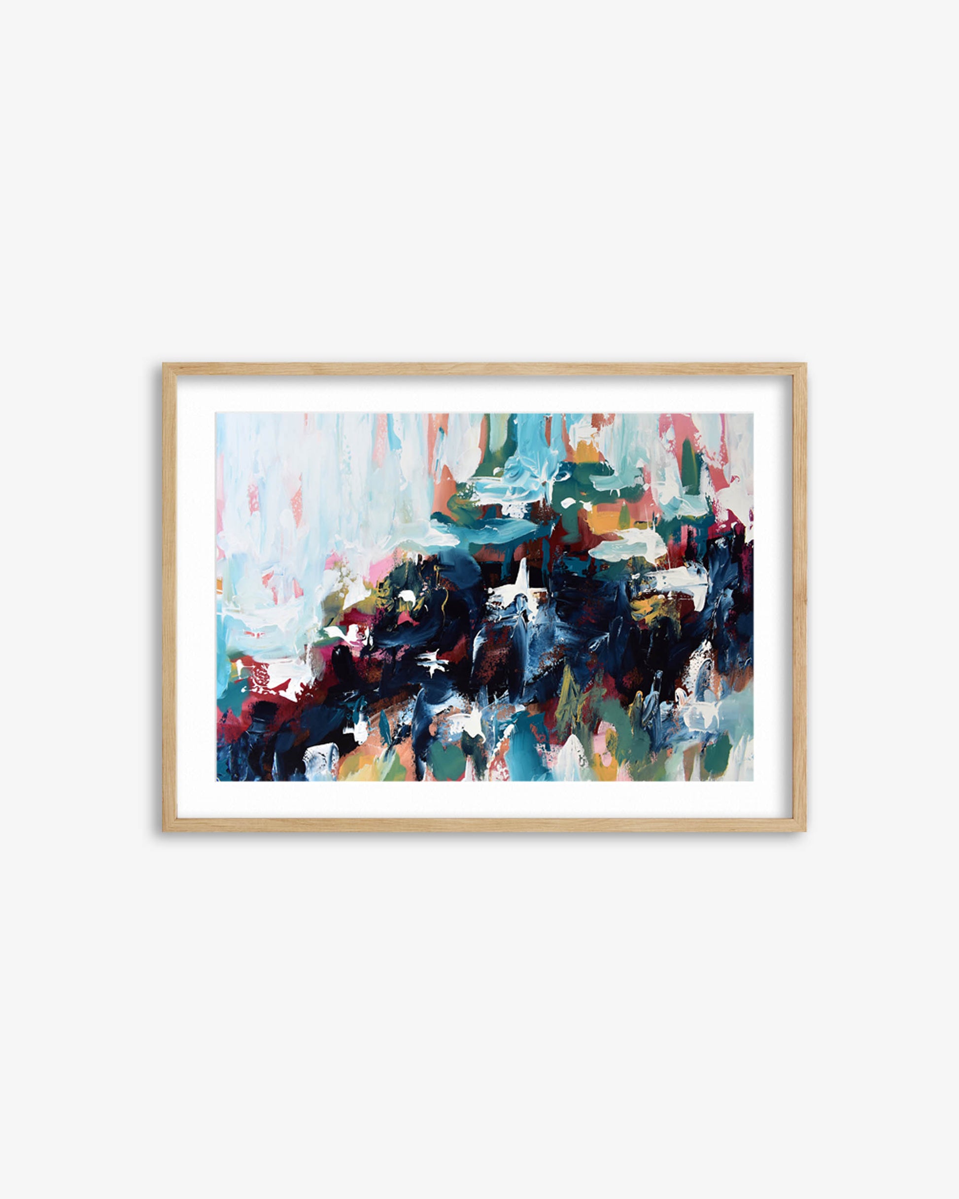 Framed abstract painting with colorful brush strokes on a white wall