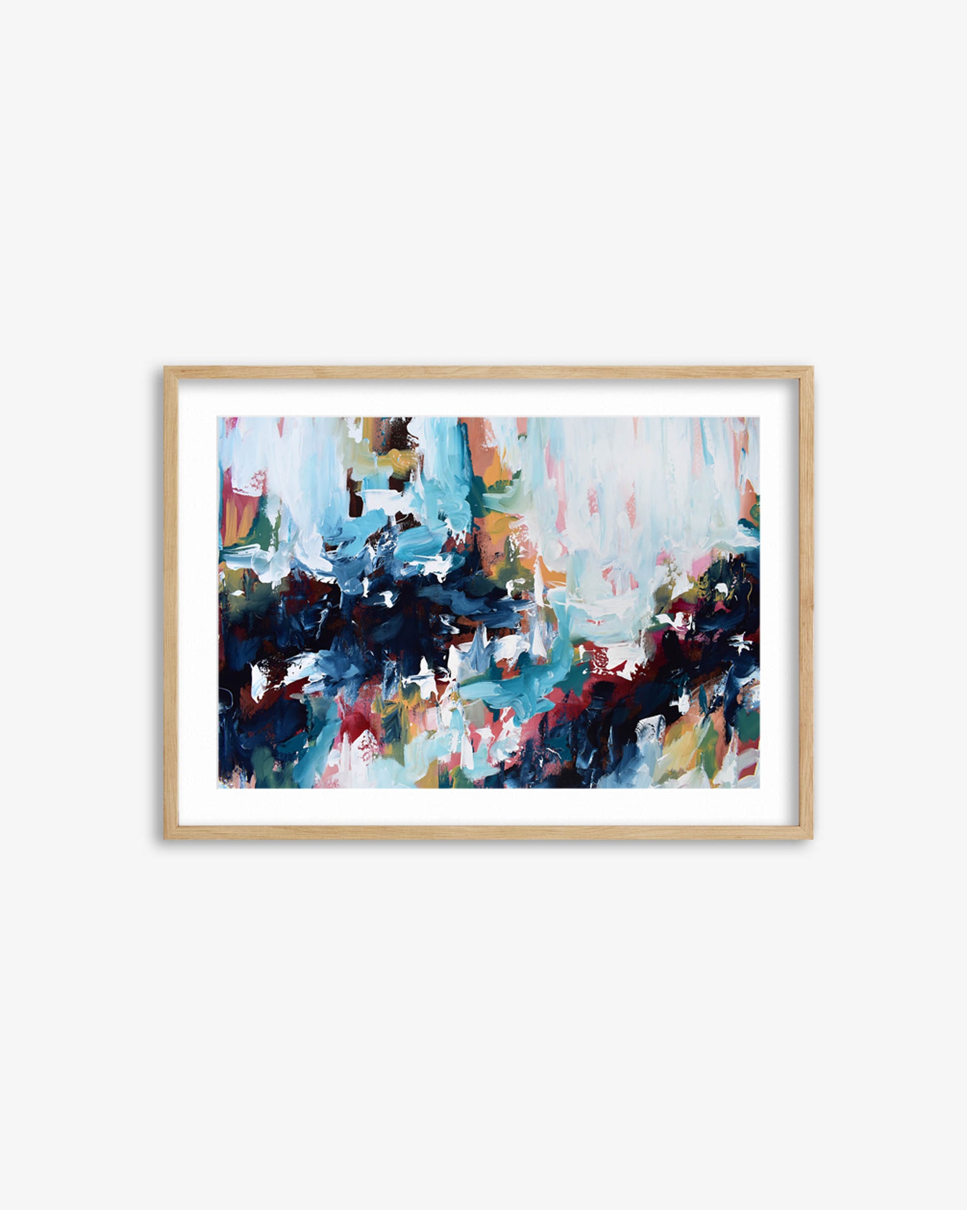 Framed abstract painting with colorful brush strokes on a white wall