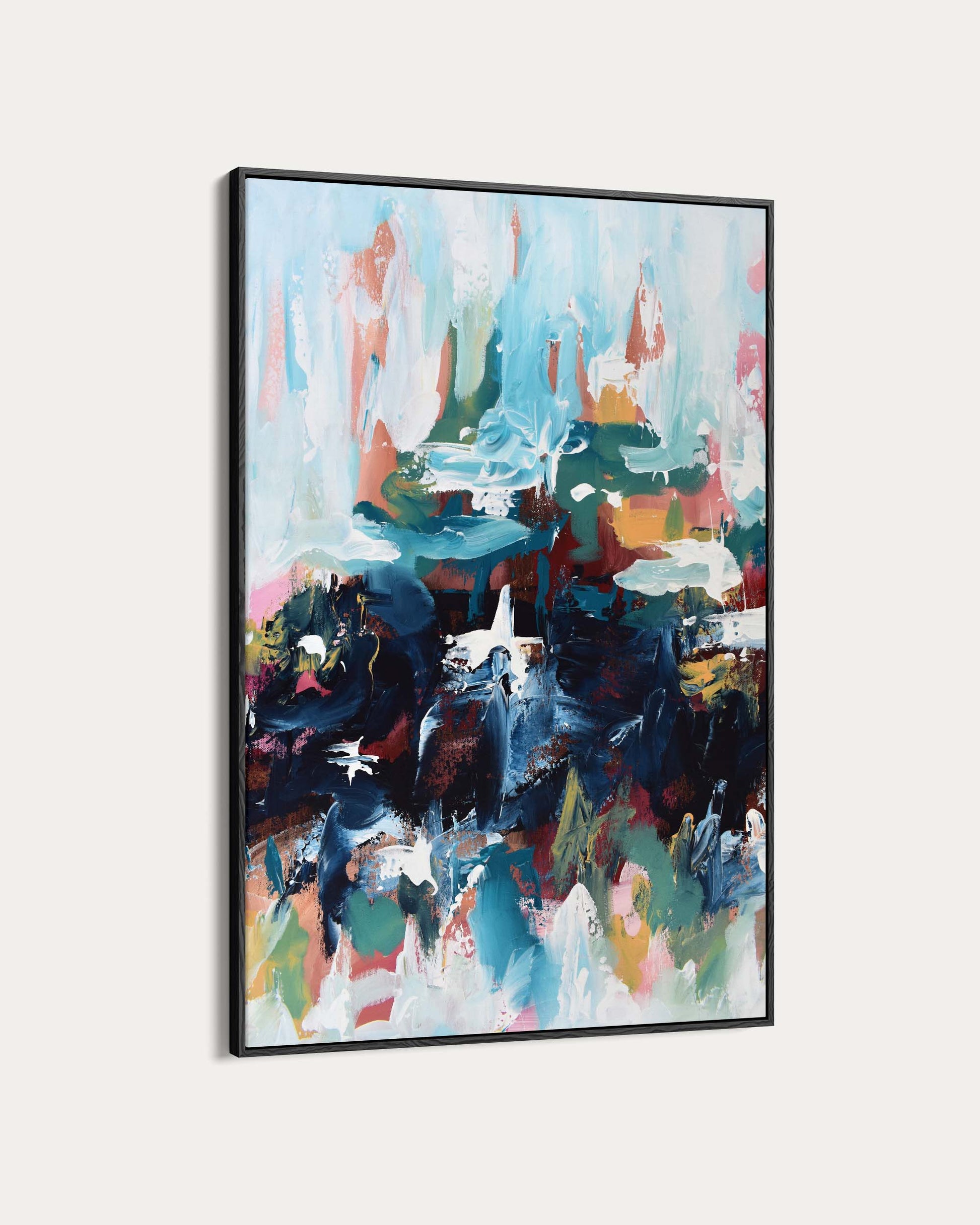 Abstract painting with vibrant colors in a black frame on a white background