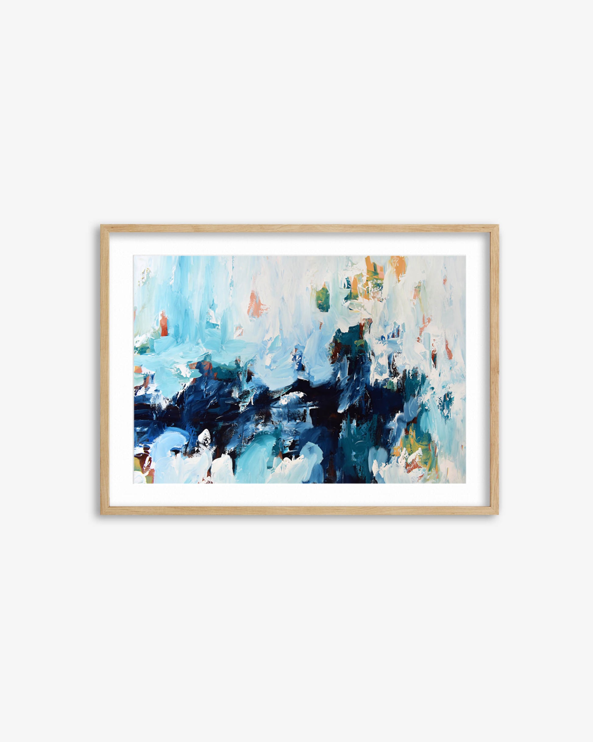 Framed abstract art print with blue and white colors on a white wall
