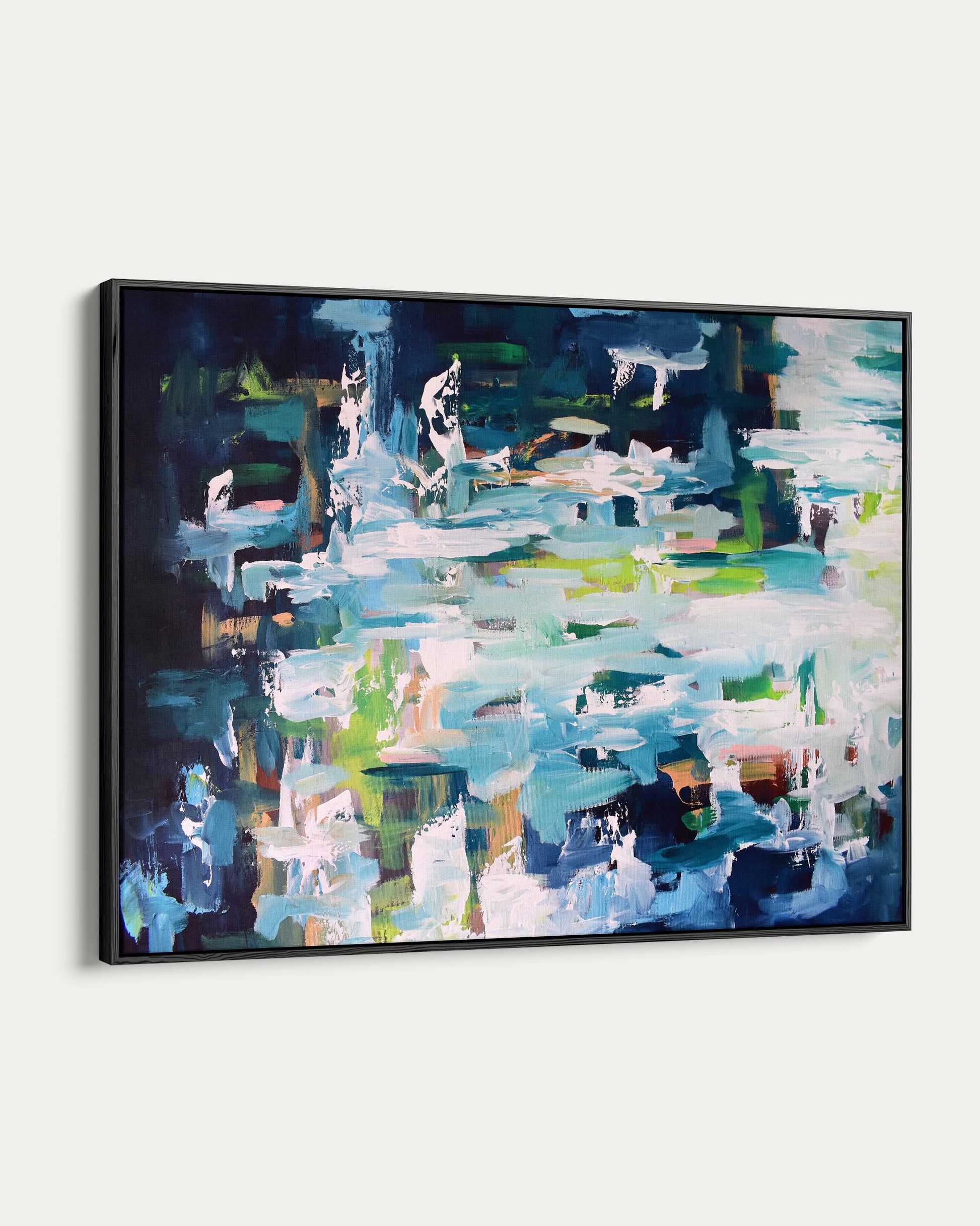 Framed abstract painting with a colorful palette on a white background