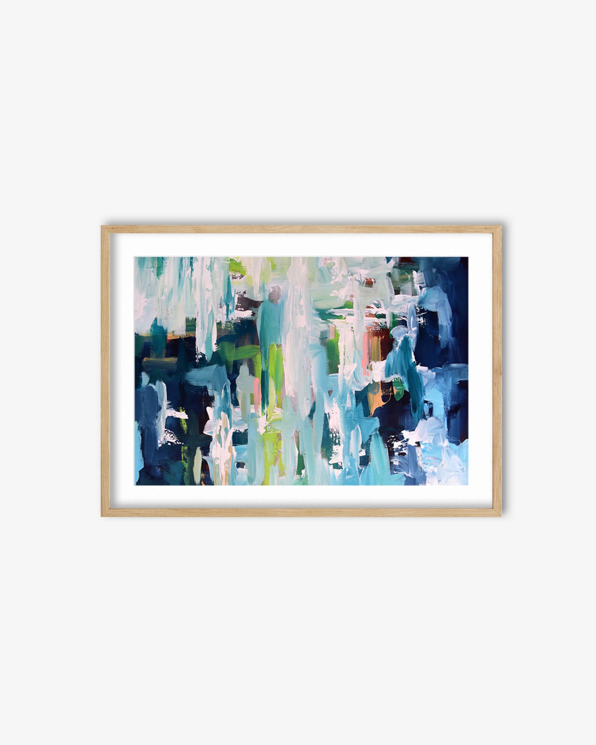 Framed abstract art print with blue and green colors on a white wall