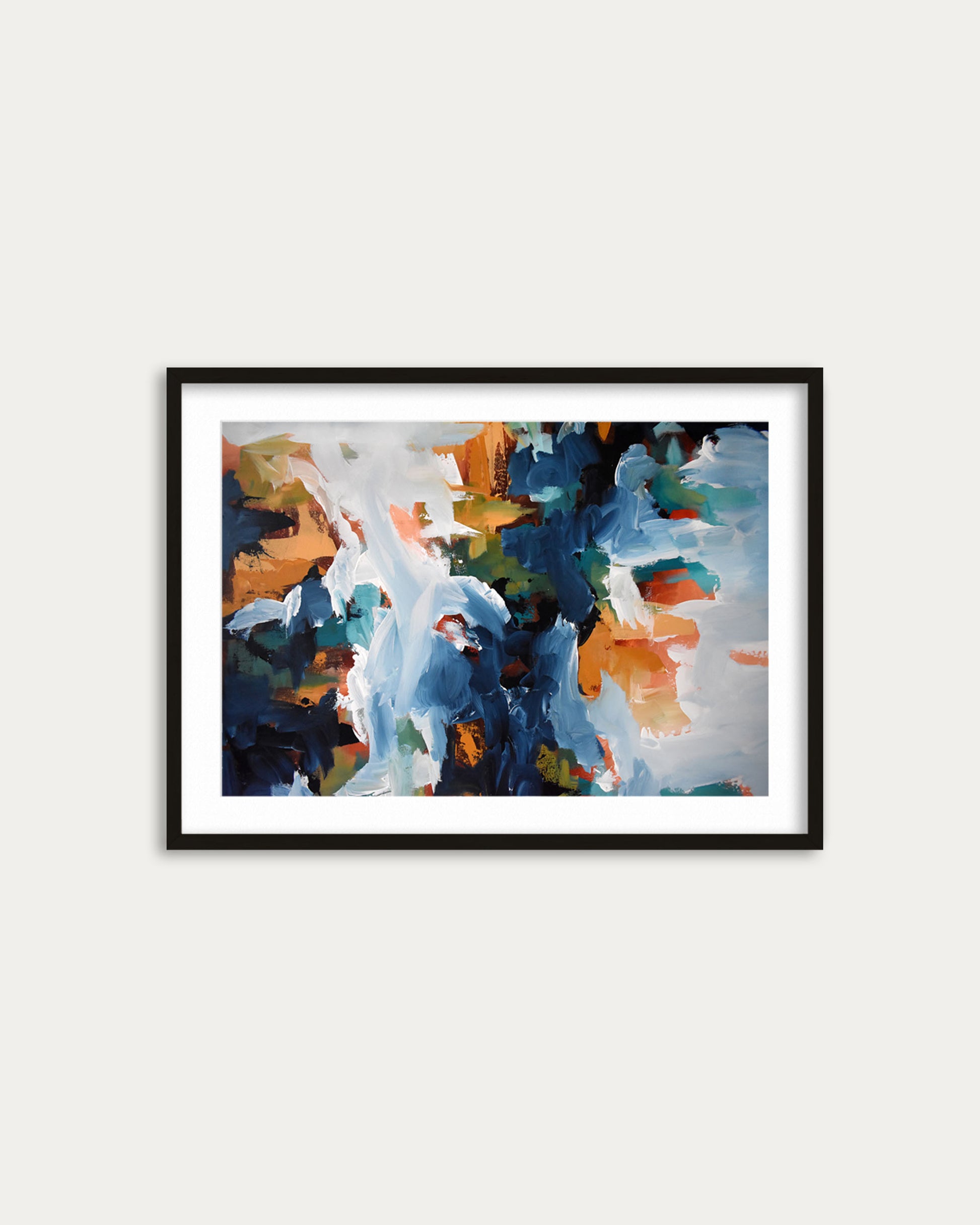Framed abstract painting with colorful brush strokes on a white wall