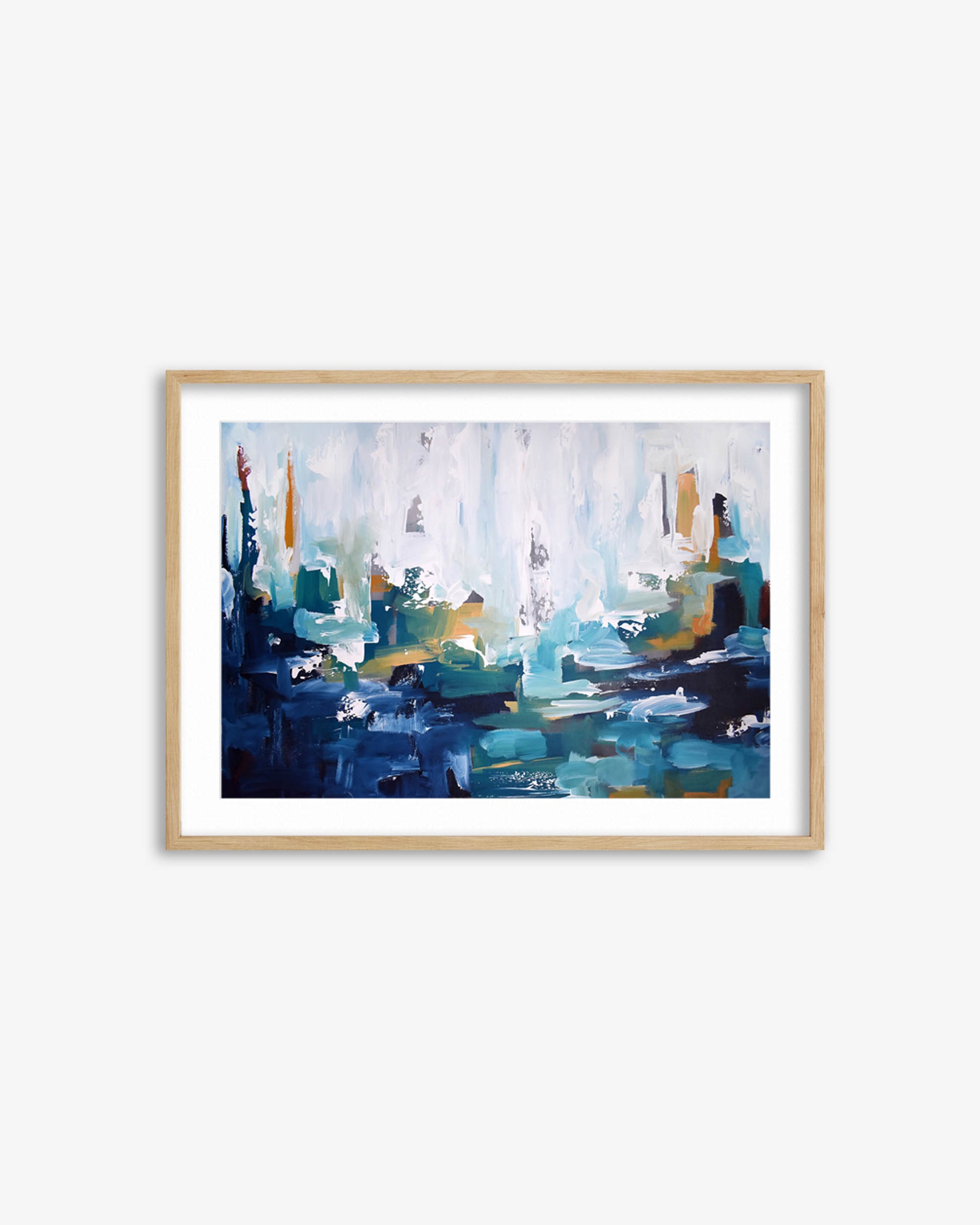 Framed abstract painting with blue and green tones on a white wall