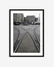 Framed black and white photograph of tram tracks in an urban setting
