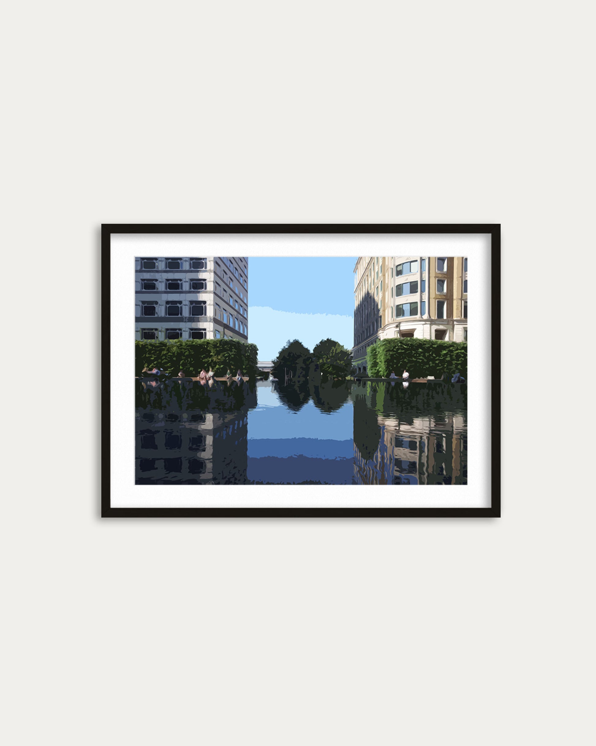 Framed artwork of a cityscape with buildings and water on a white wall