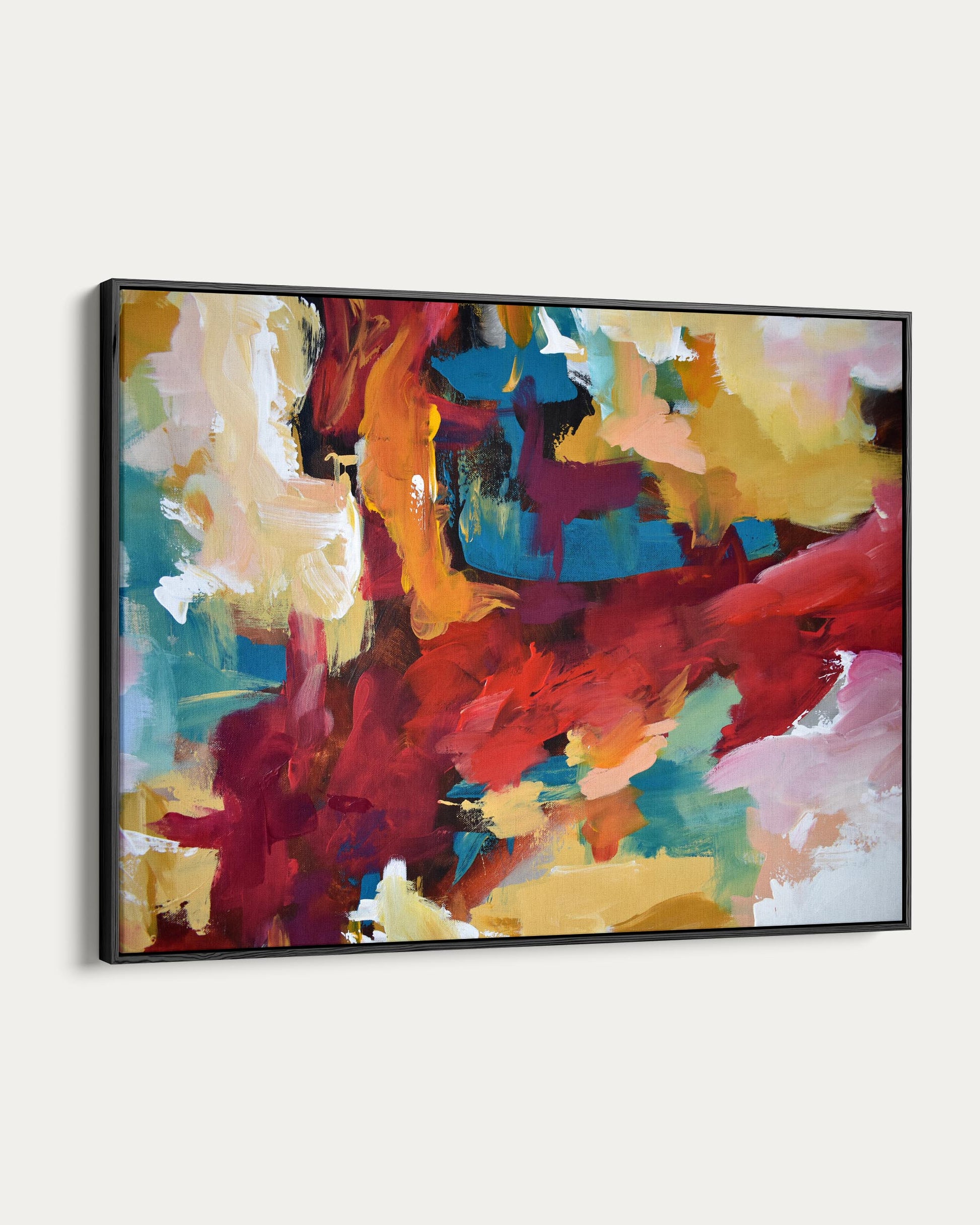 Abstract painting with vibrant colors on a white wall