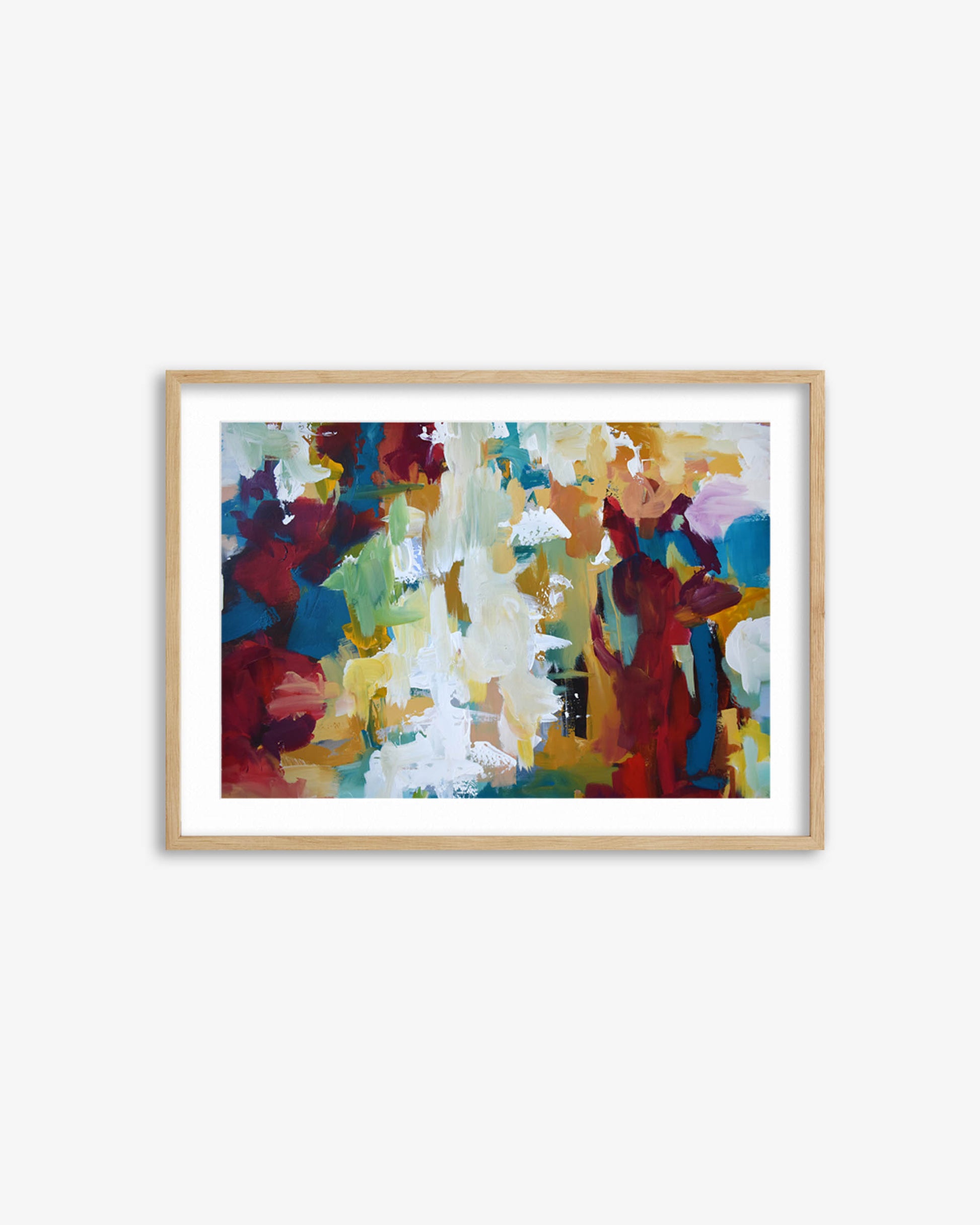 Framed abstract painting with colorful abstract design on a white wall