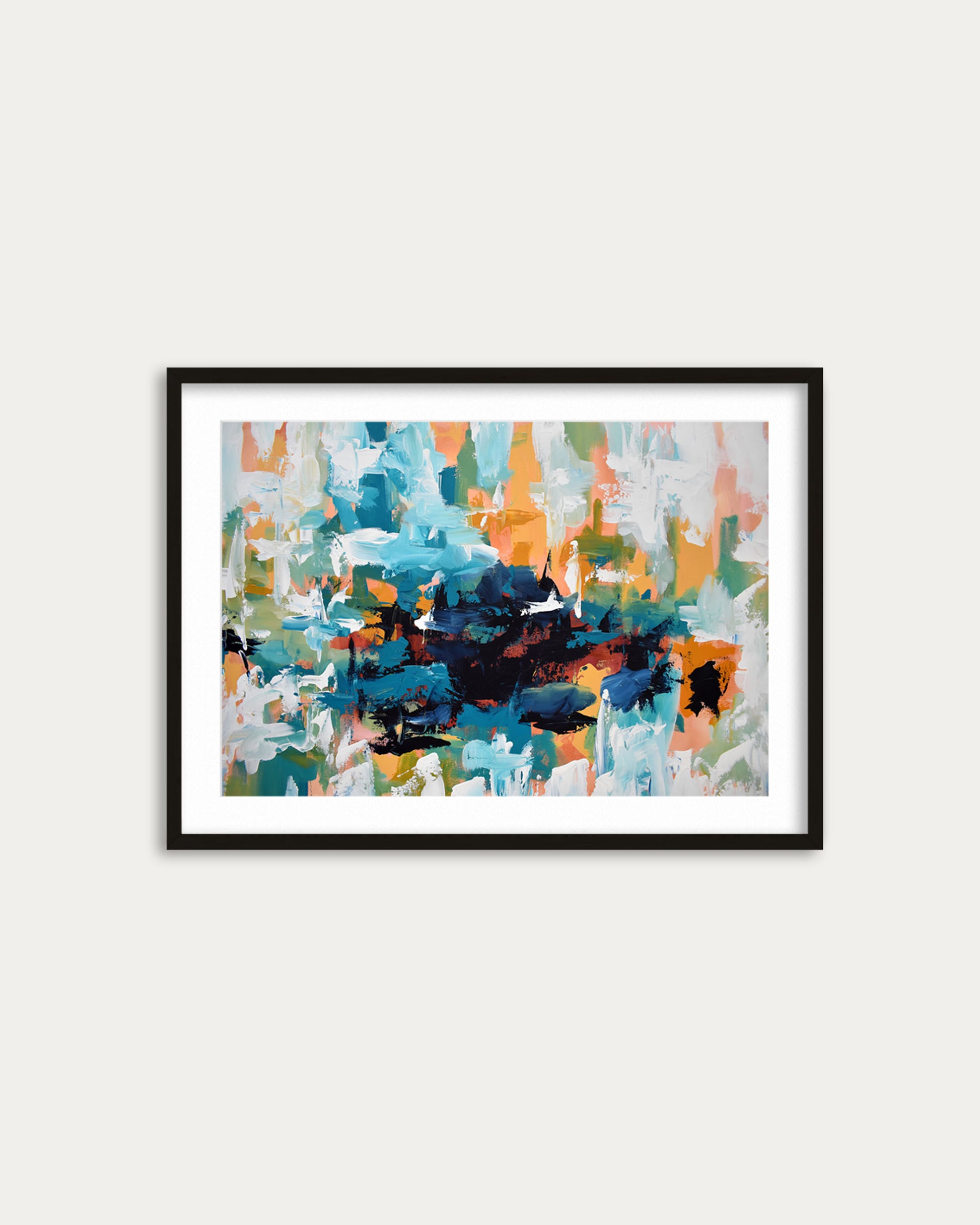 Framed abstract art print with colorful brush strokes on a white wall