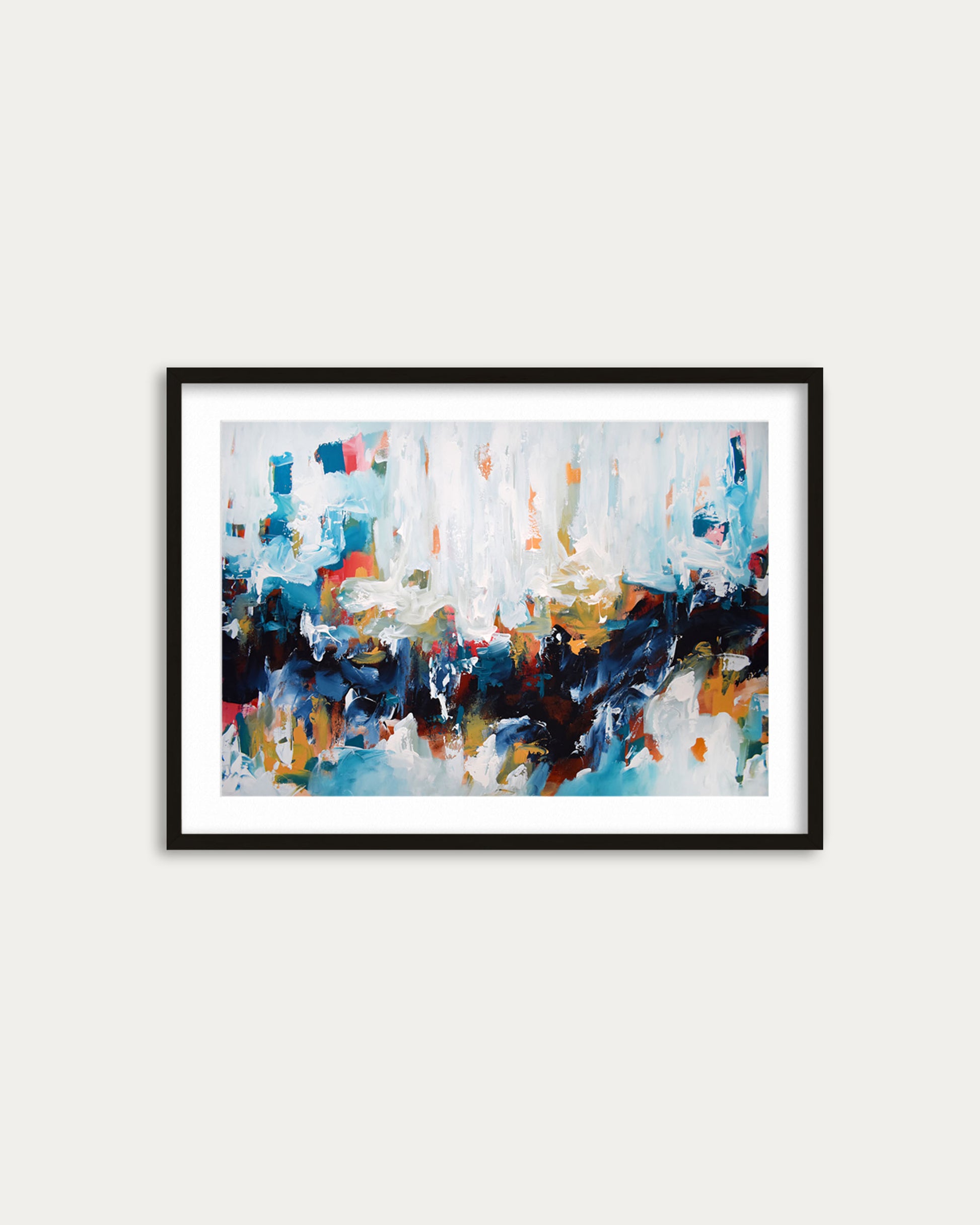 Framed abstract painting with colorful brush strokes on a white wall
