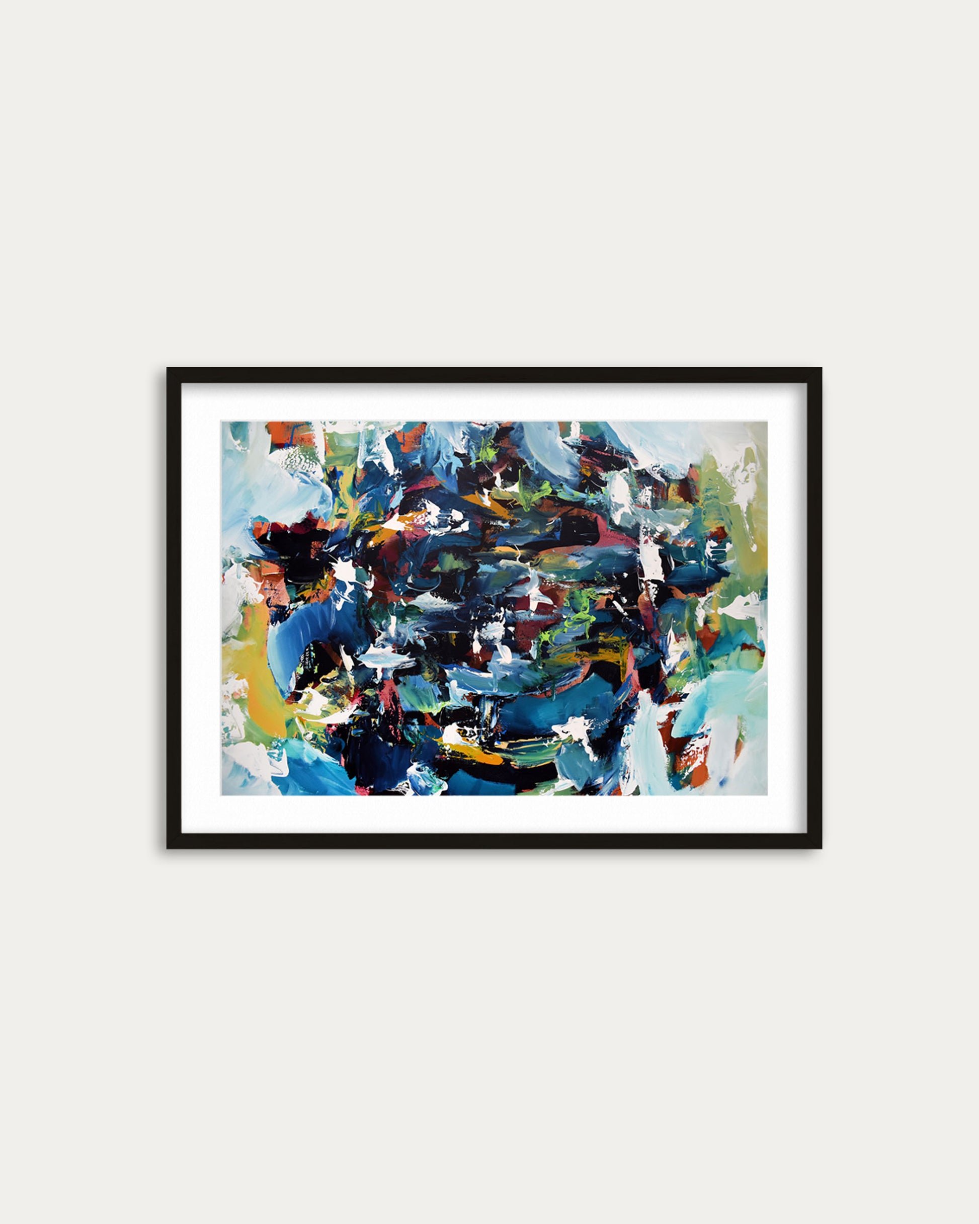 Framed abstract painting with colorful abstract design on a white wall