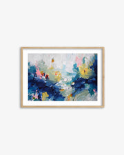Framed abstract painting with blue, pink, and yellow colors on a white wall.