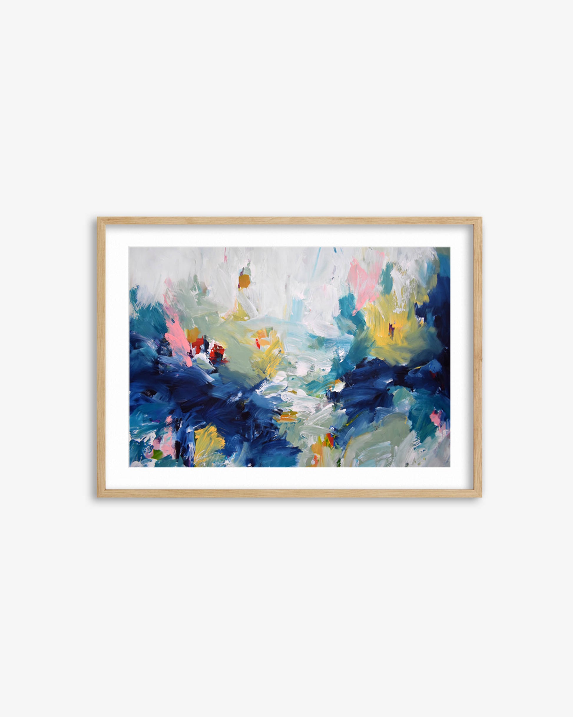Framed abstract painting with blue, pink, and yellow colors on a white wall.