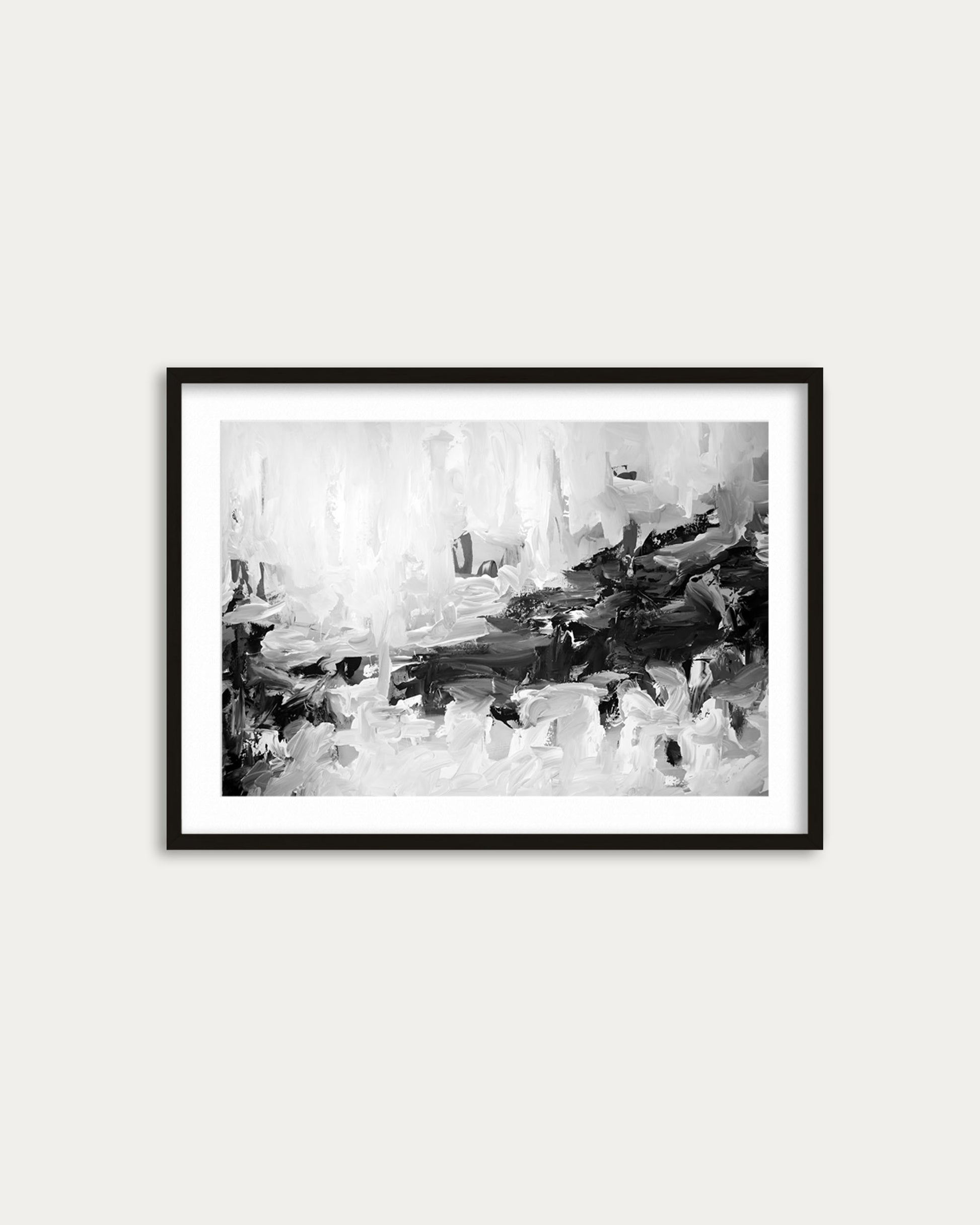 Framed black and white abstract art print on a white wall