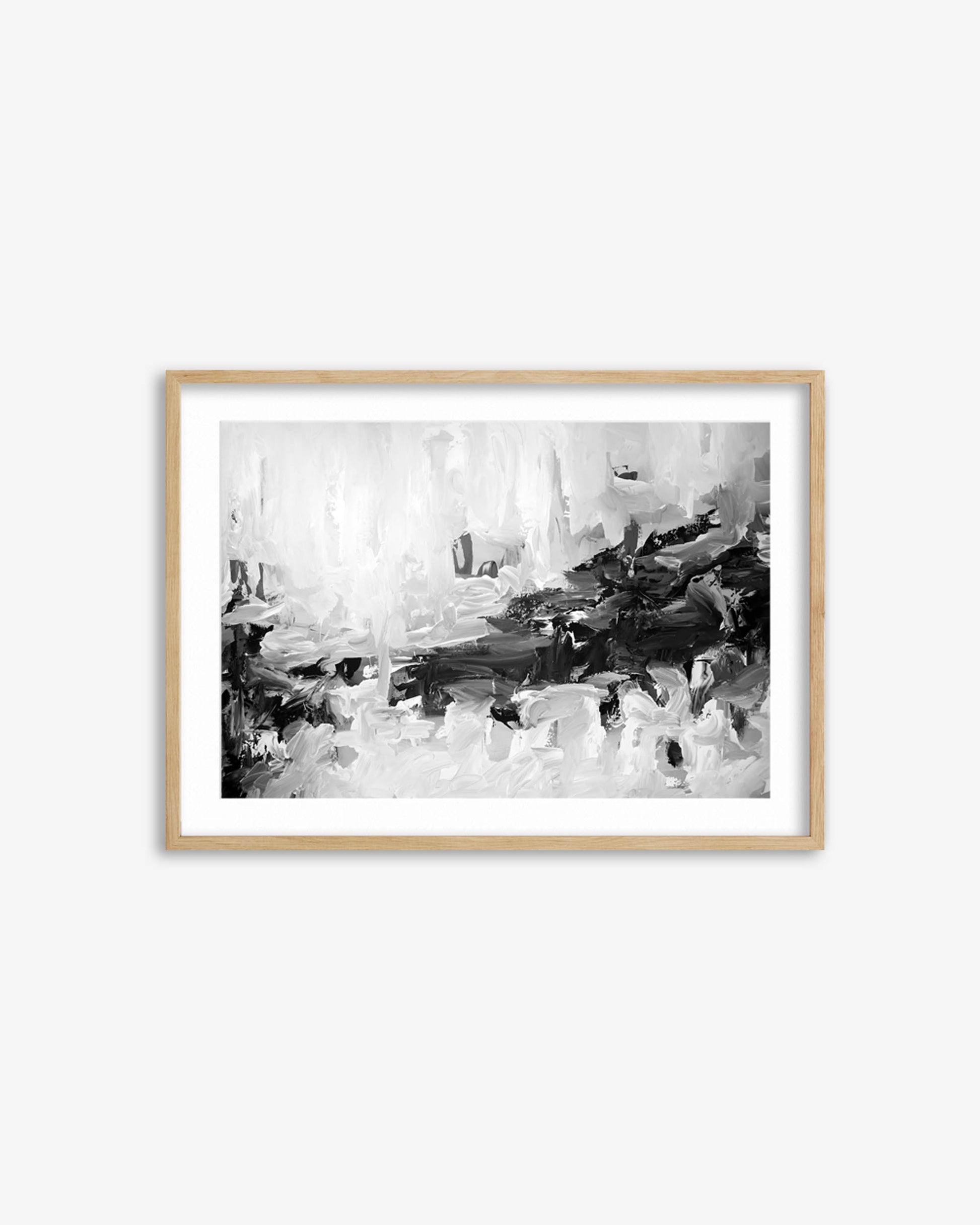 Framed black and white abstract art print on a white wall