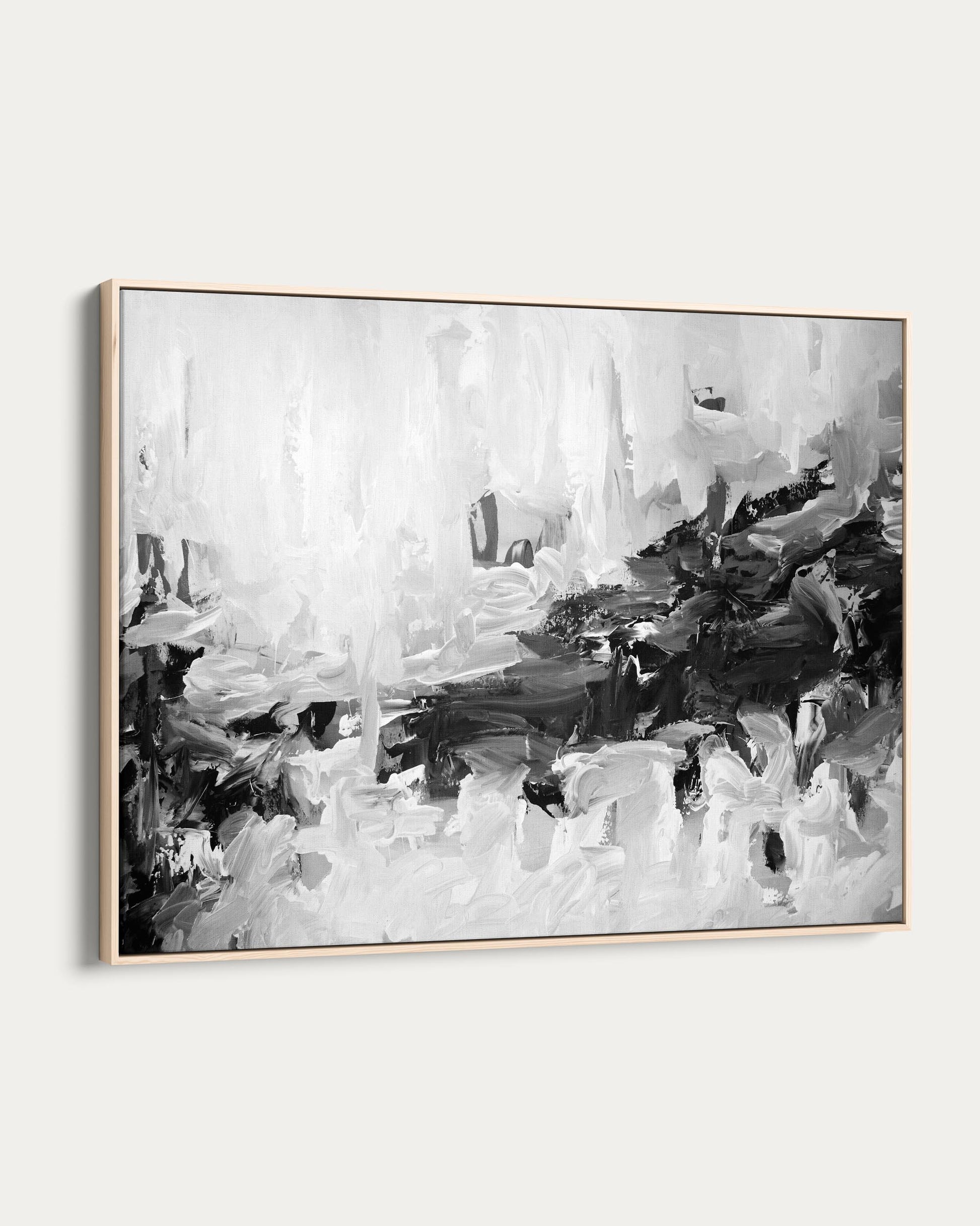Abstract black and white painting in a gold frame on a white background