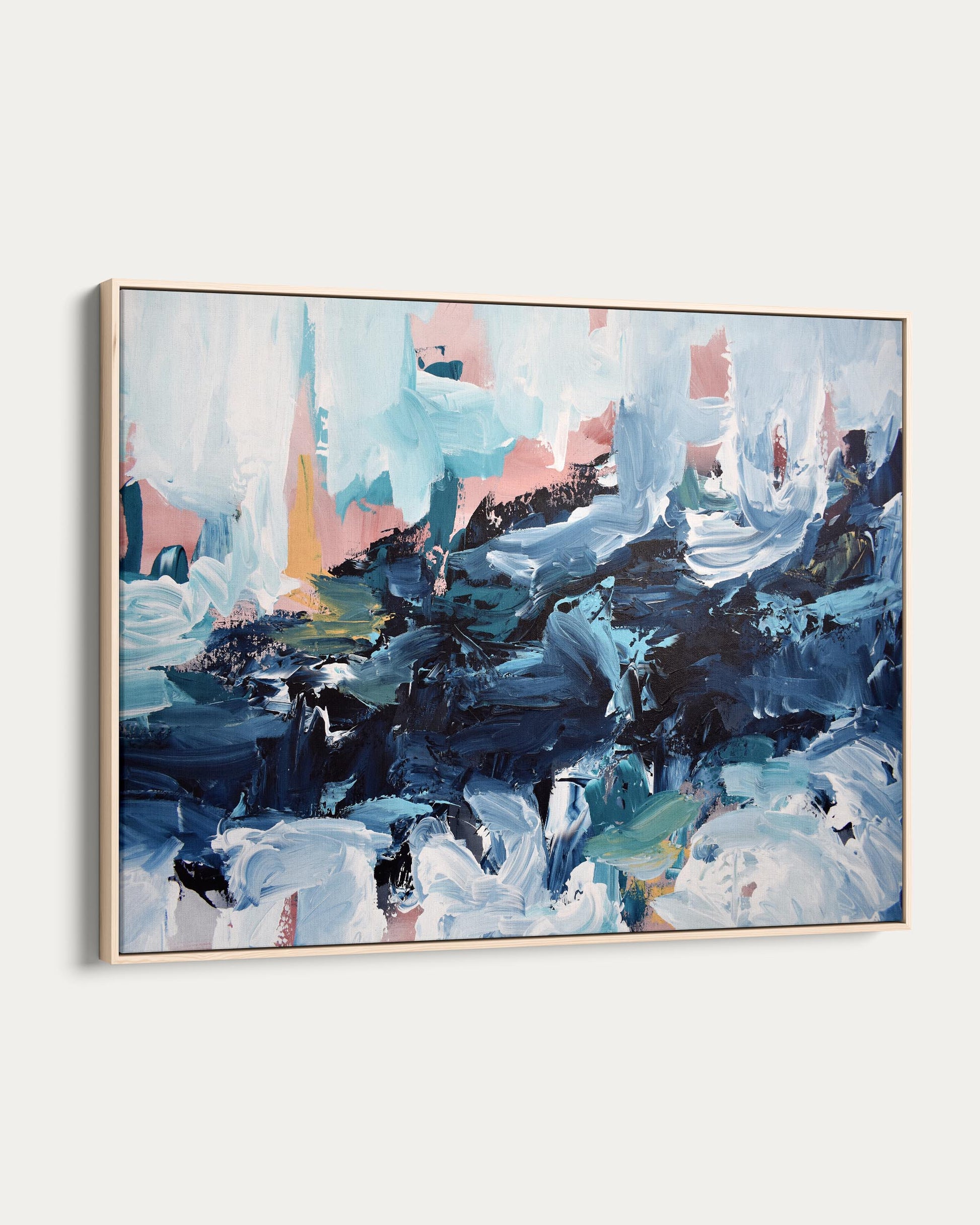 Abstract painting with blue, pink, and black colors on a white wall