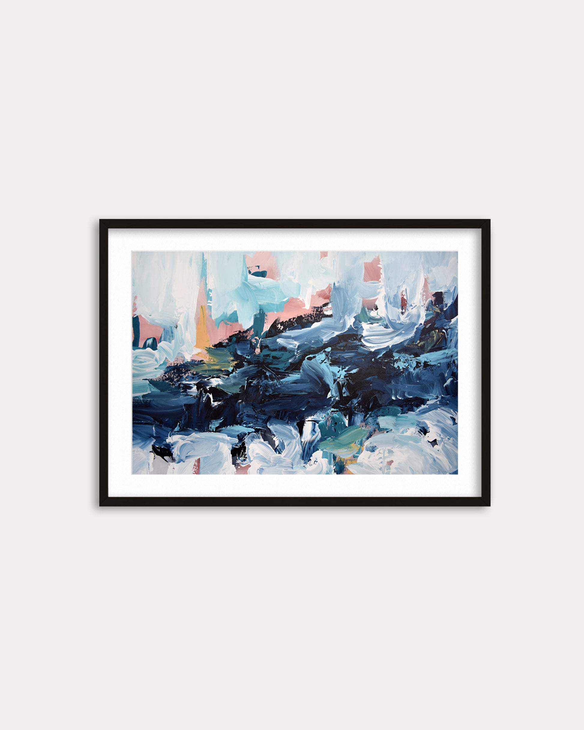 Framed abstract painting on a white wall