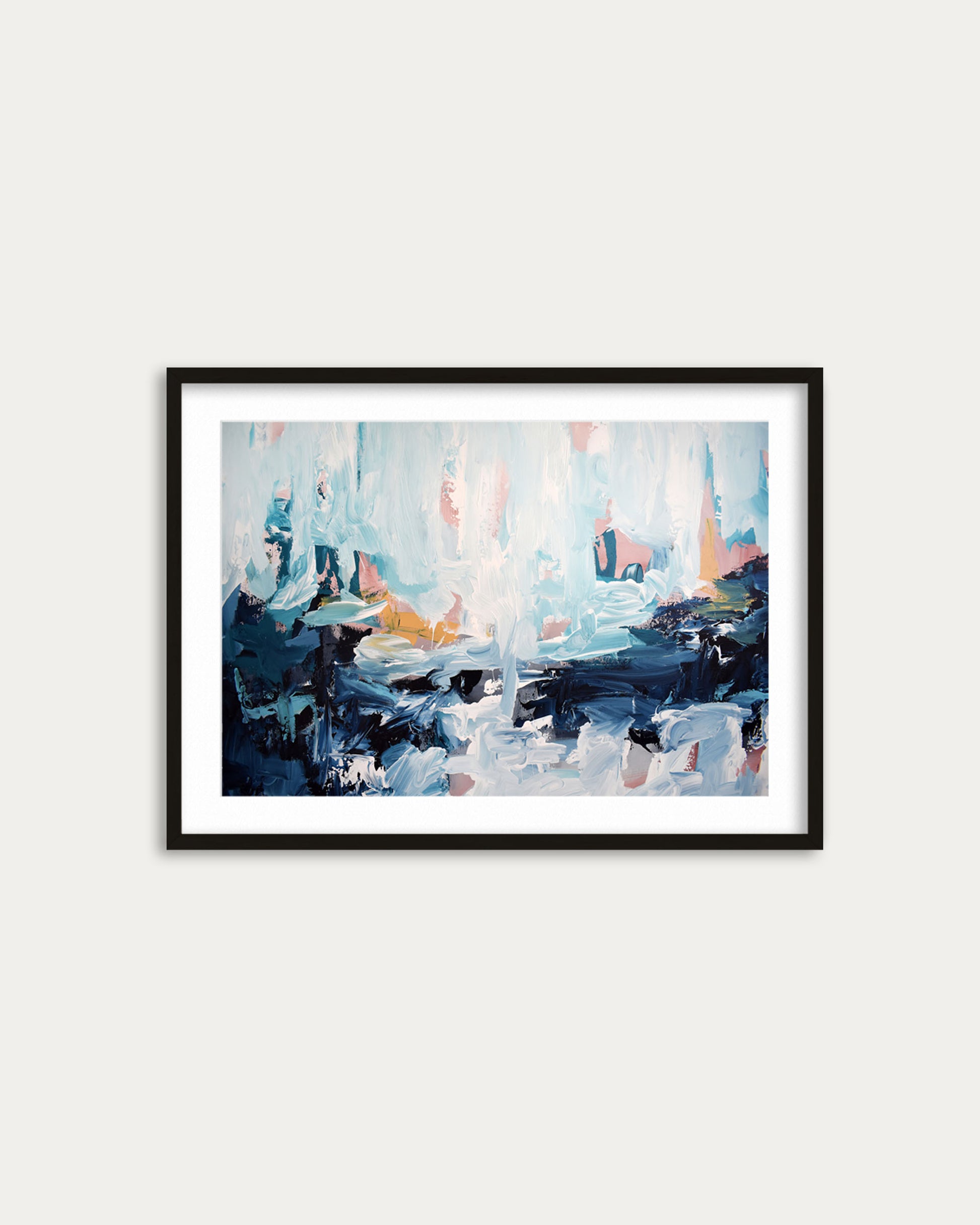 Framed abstract painting on a white wall