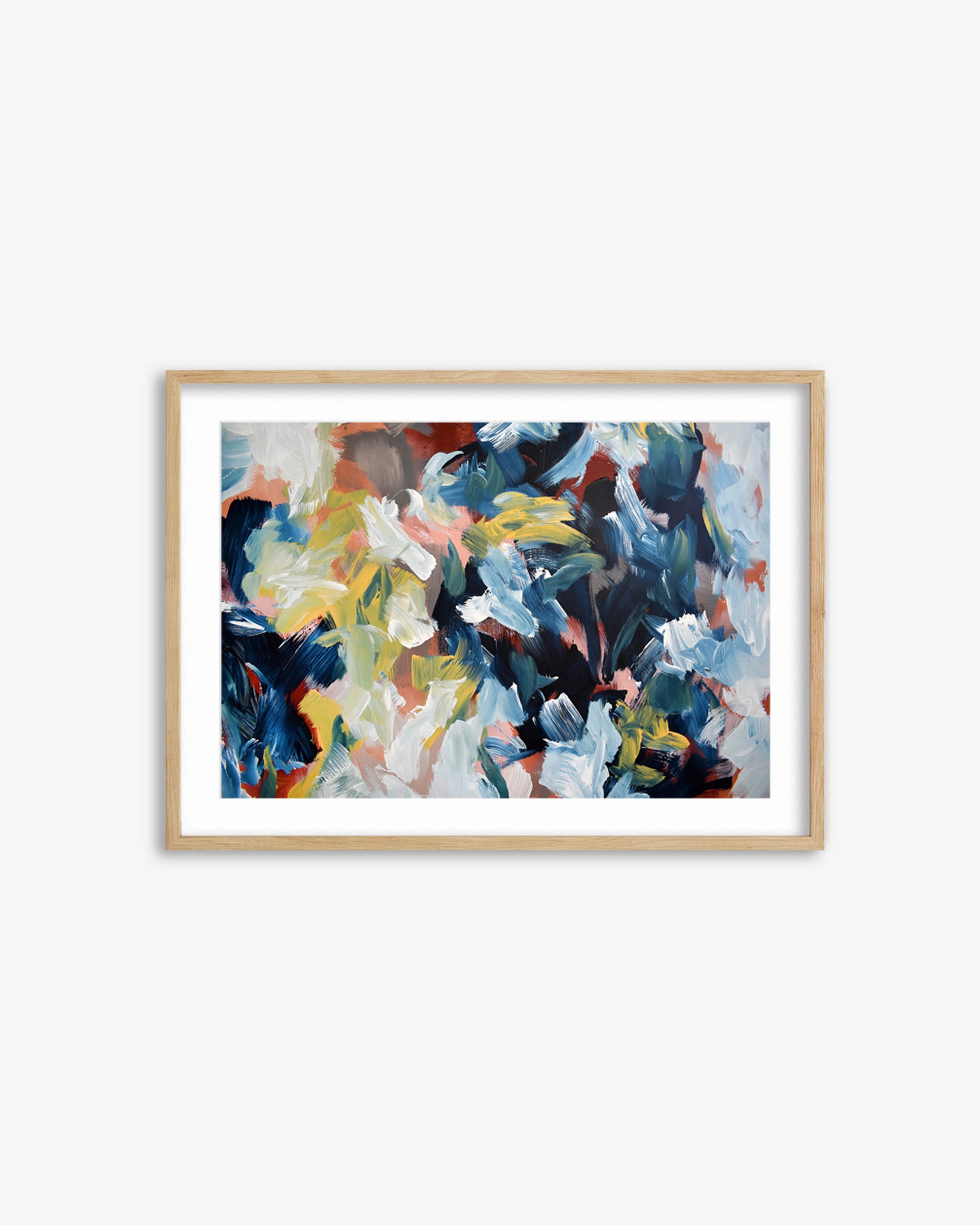 Framed abstract painting with colorful flowers on a white wall