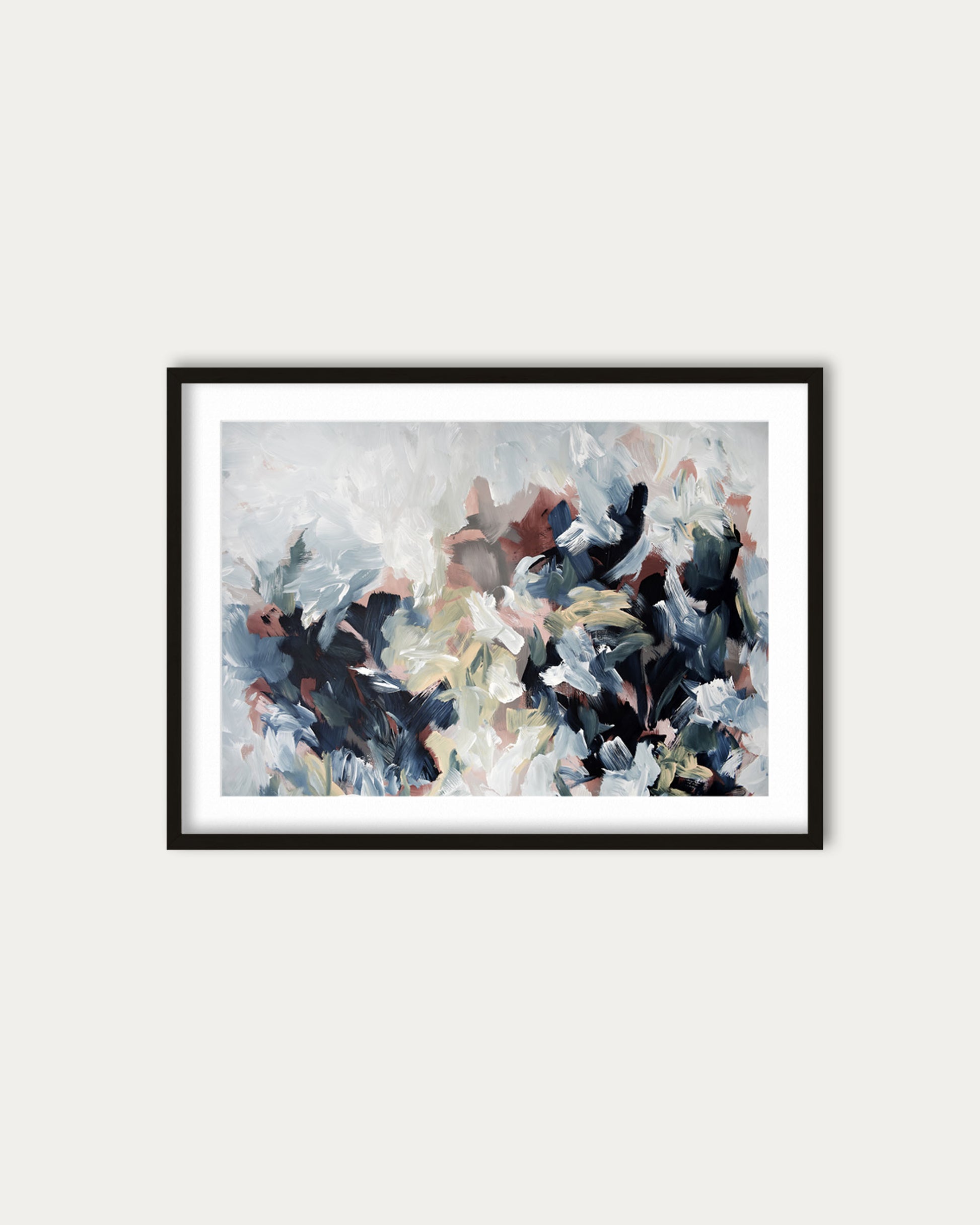 Framed abstract painting on a white wall