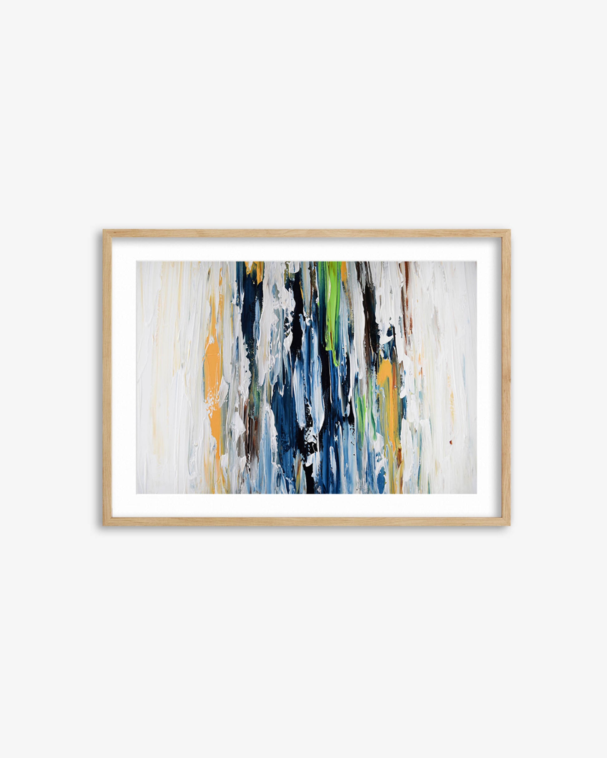 Framed abstract art print with colorful brush strokes on a white wall