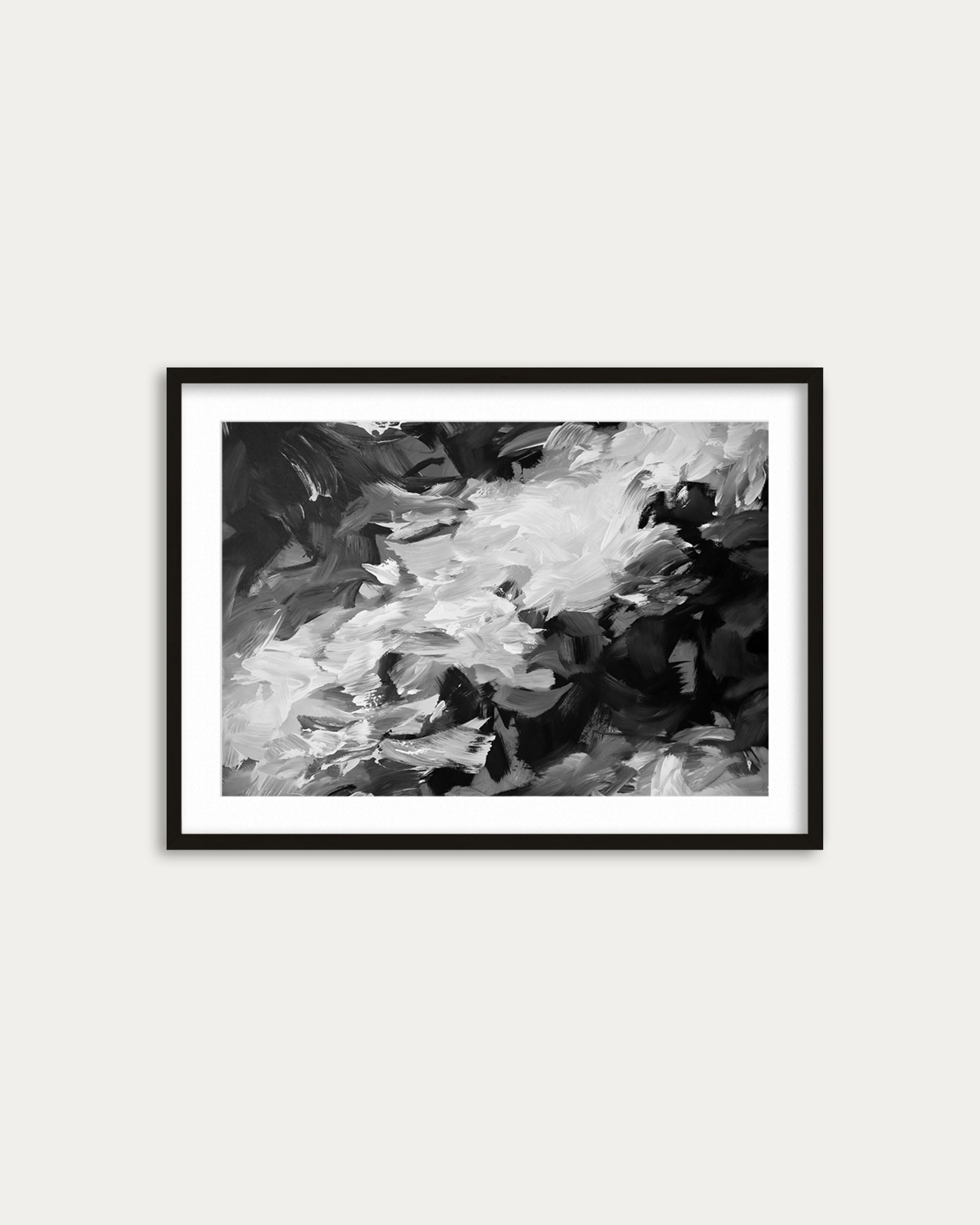 Framed black and white abstract painting on a light gray wall