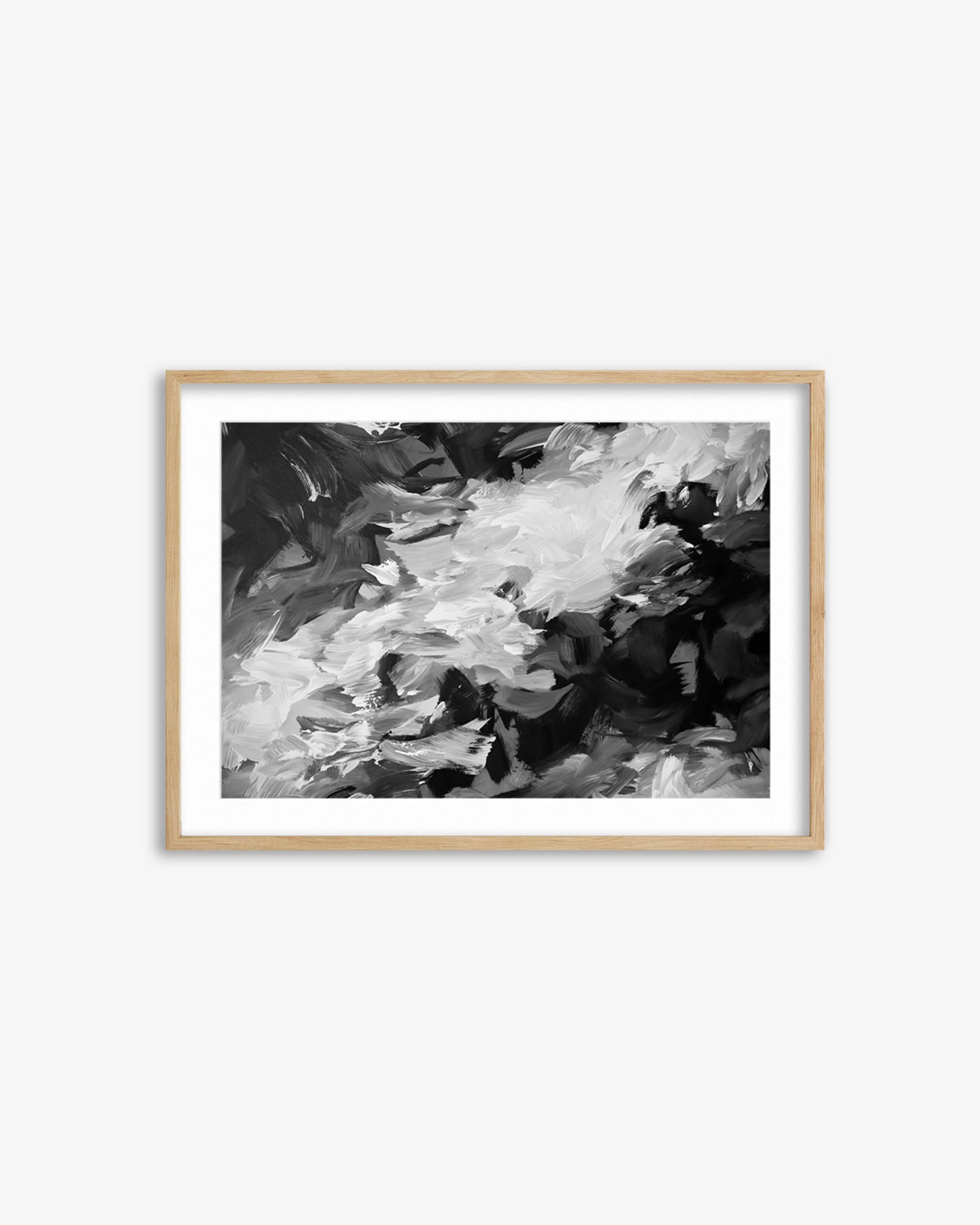 Framed black and white abstract art print on a white wall