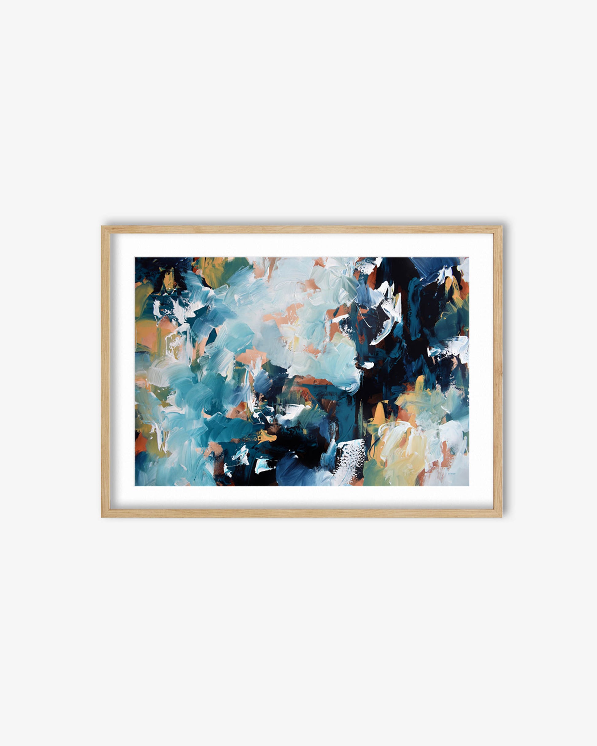 Framed abstract art print with blue and brown tones on a white wall