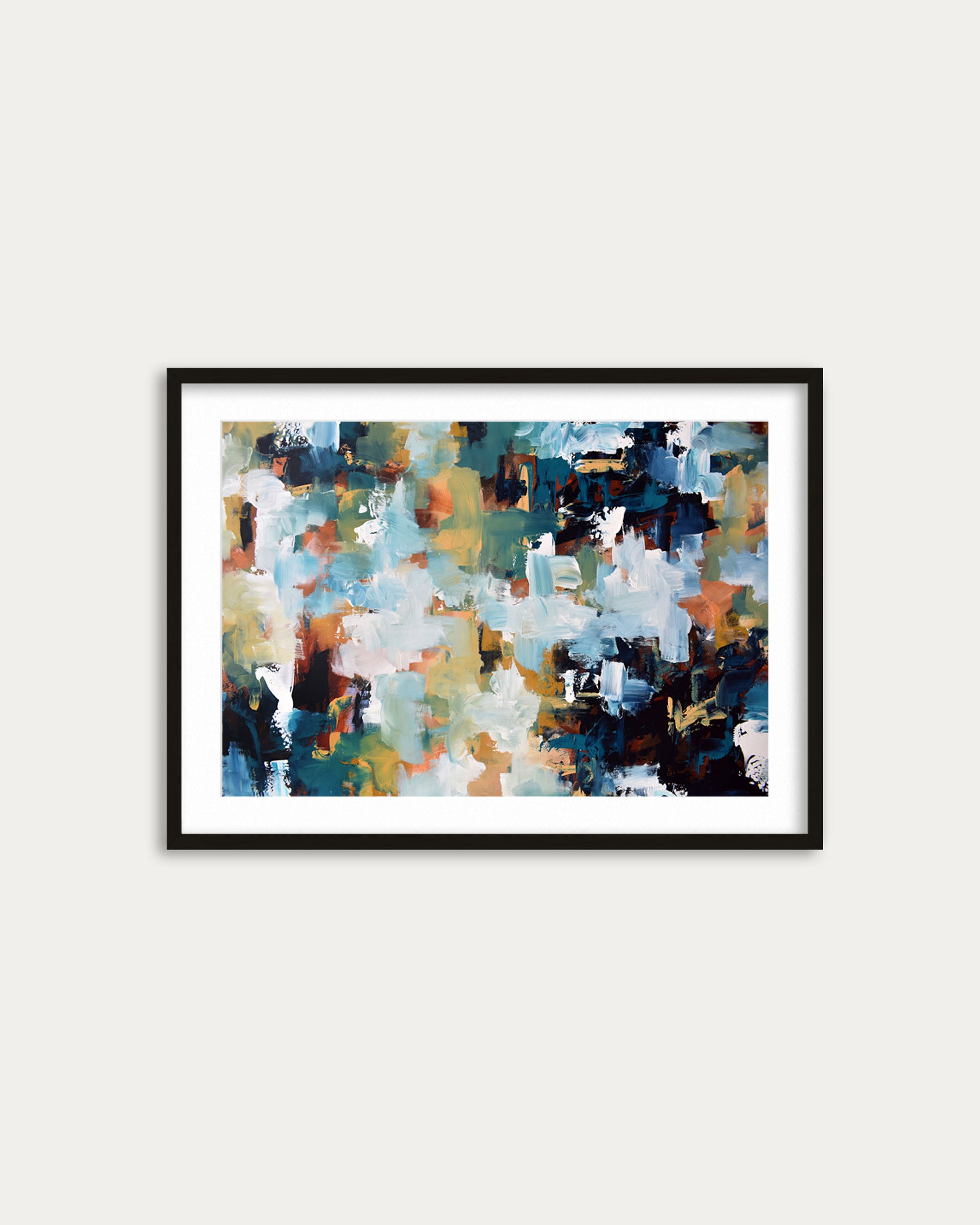 Framed abstract art print with multicolor palette on a white wall