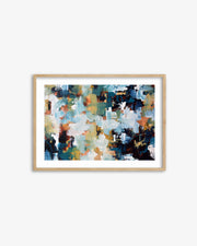 Framed abstract art print with multicolor palette on a white wall
