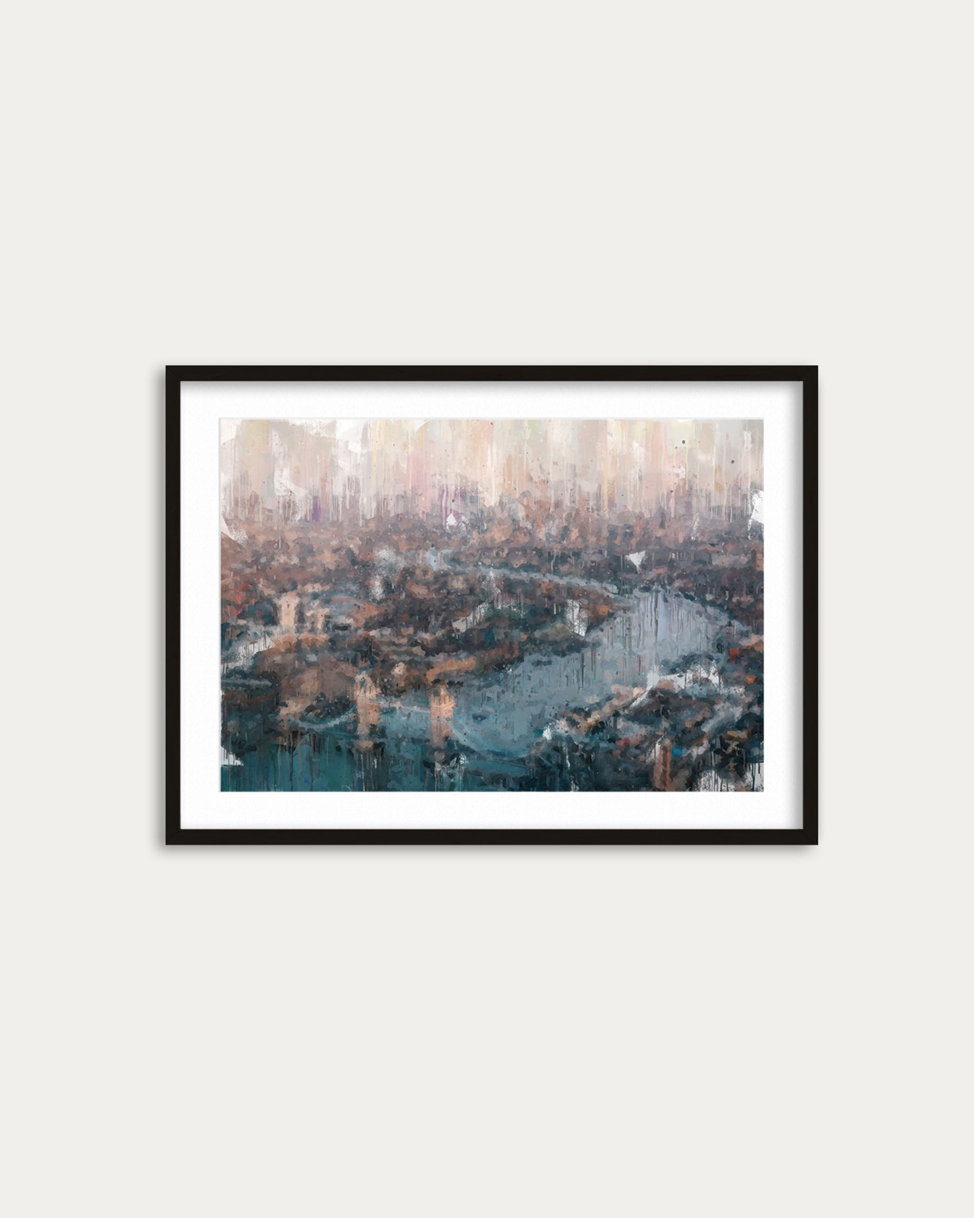 Framed cityscape print on a white wall