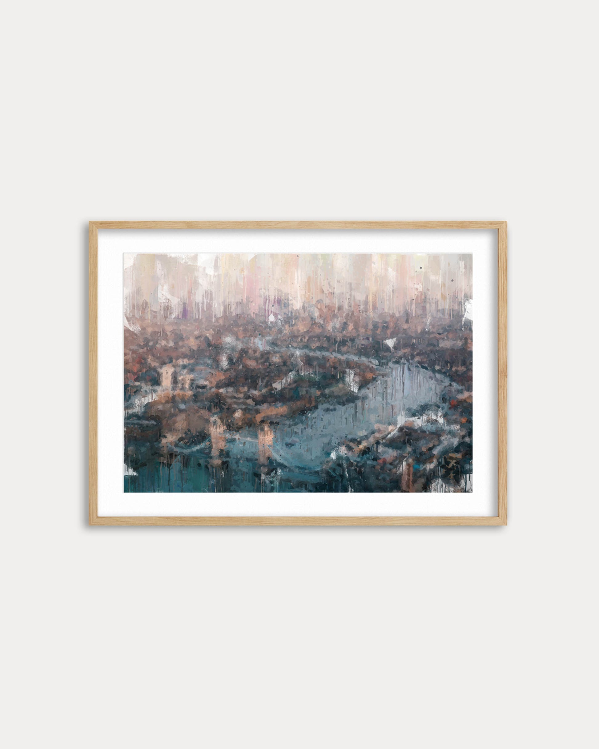 Framed artwork of a cityscape with a river and bridges on a white wall